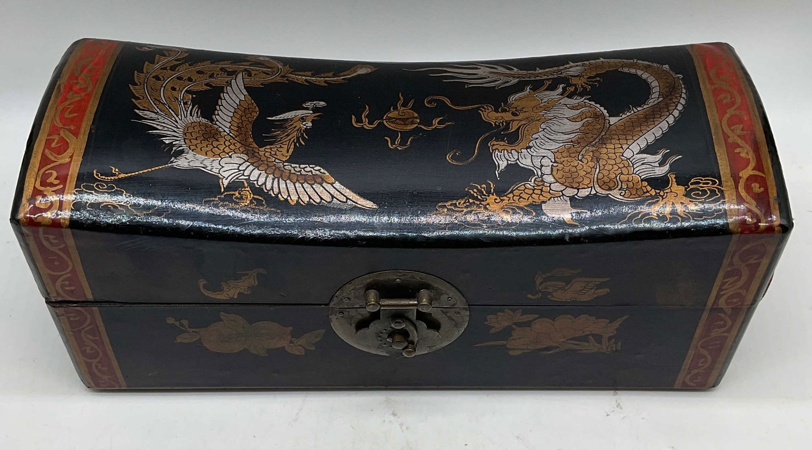 Vtg Chinese Lacquered Leather Pillow Box: Vintage Chinese leather covered wood pillow box. Hand painted lacquered gilt decoration with dragon and phoenix motif. Measures approx. 12 x 4.5 x 5.25 inches. Wear including losses, scratching, lid a