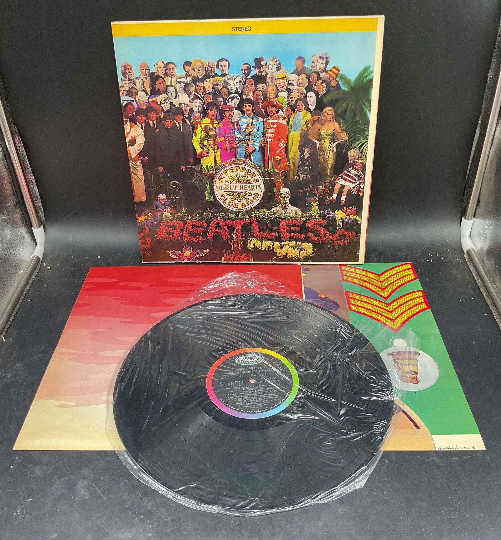 1967 The Beatles Sgt Peppers 1st American Press: First American pressing of Sgt Peppers Lonely Hearts Club Band (stereo) by The Beatles. Capitol Records/EMI. Catalog number SMAS 2653. Includes album sleeve, vinyl record, psychedelic pink inner sleev