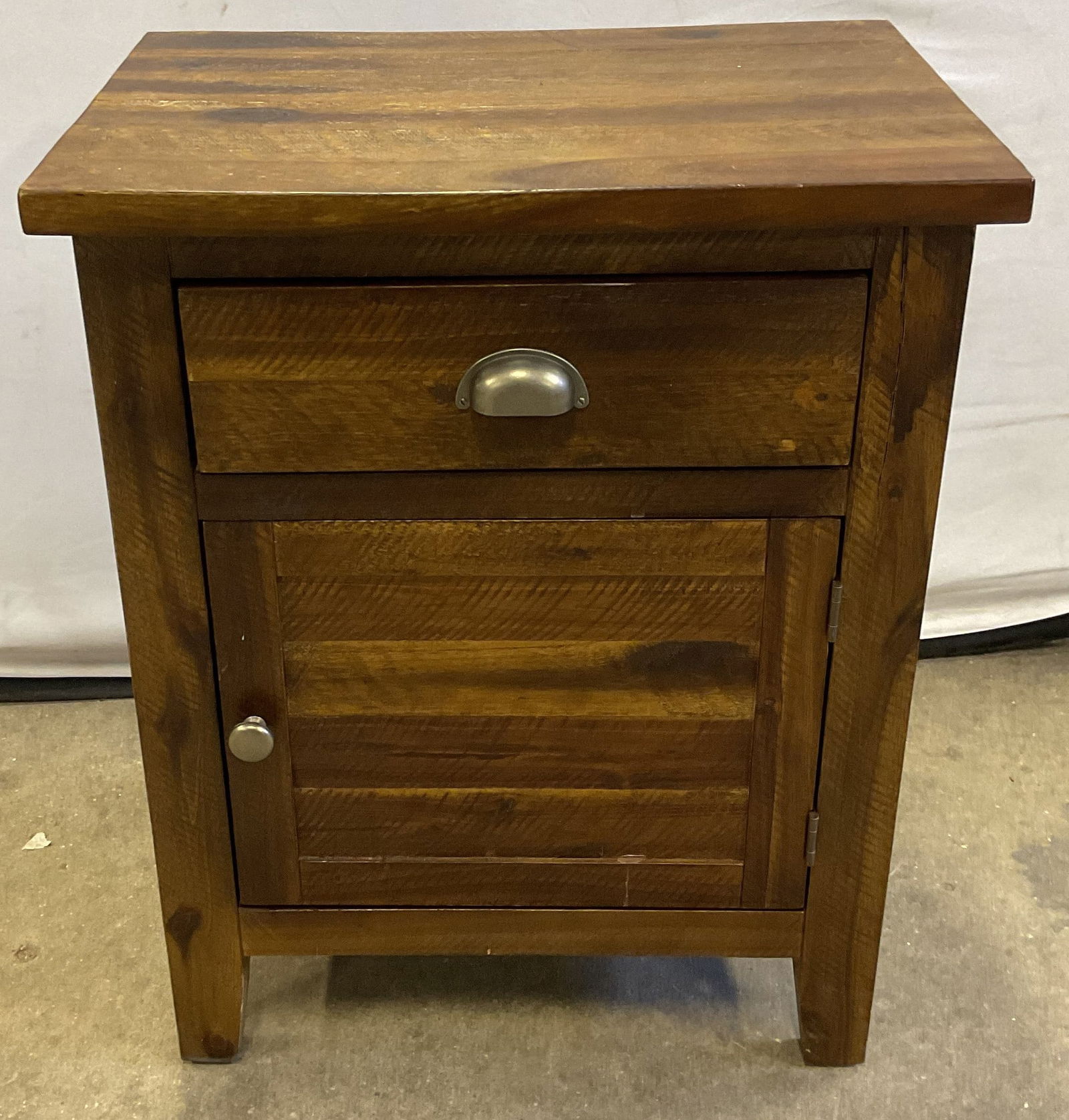 Rustic Wood Nightstand with Charging Station: Rustic farmhouse style wood nightstand with drawer and cabinet. Outlet with charging ports on side, wire on interior. Not tested. Measures approx. 20 x 13.75 x 25 inches. Some scratching. Furniture, n