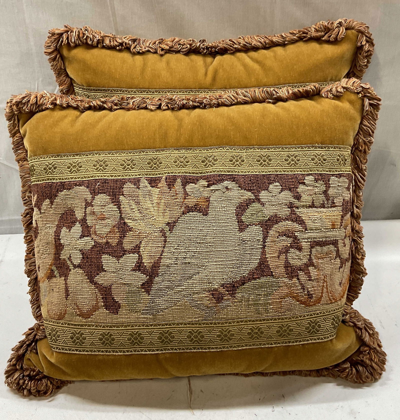 Pair Vtg Tapestry Velvet Fringe Bird Pillows: Pair of vintage pillows with handmade bird tapestry panels and tan velvet backing. Fringe trim. Measures approx. 17 x 20 inches, wear including discoloration. Pillow, throw pillow, accent pillow, deco