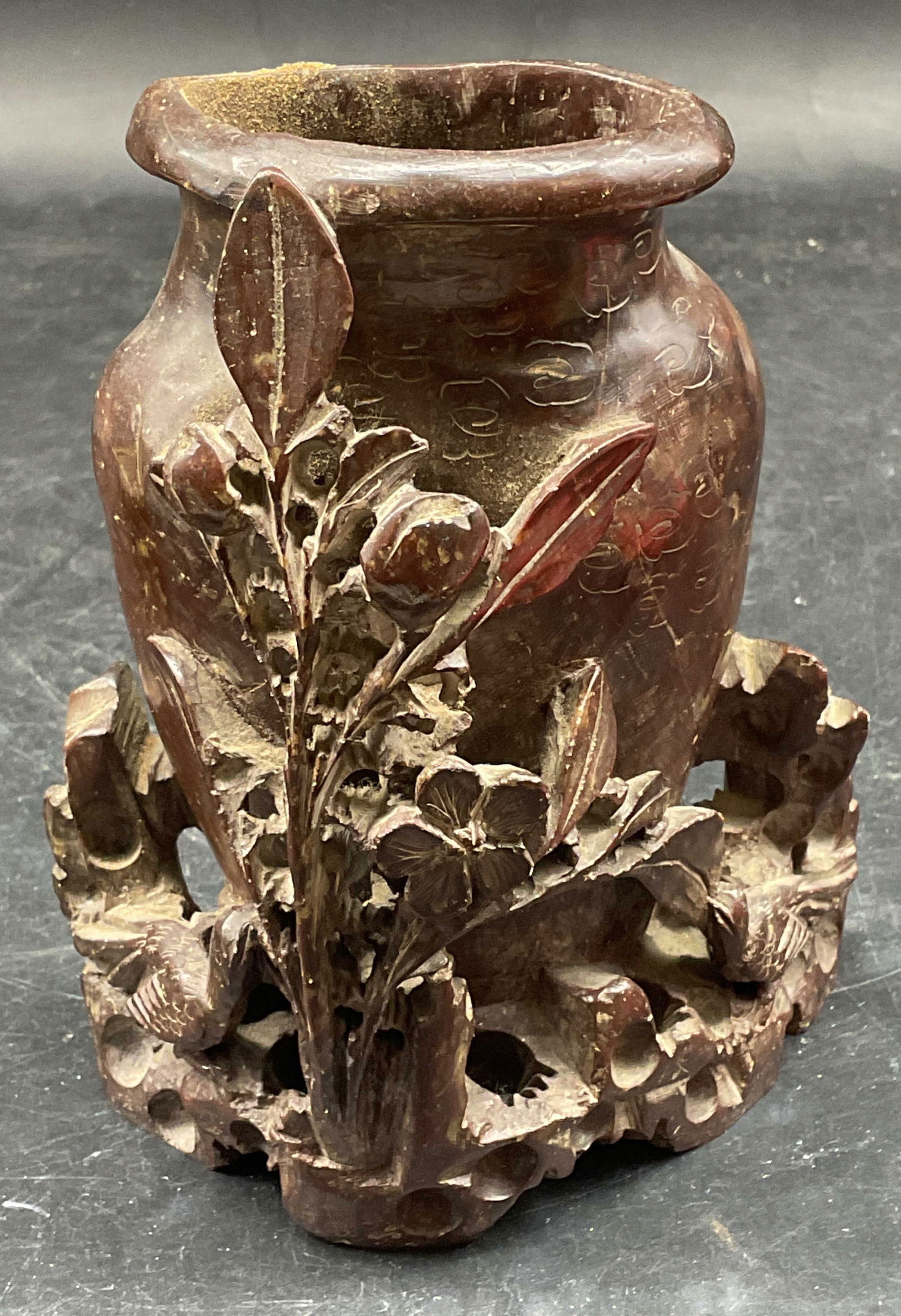 Carved Floral Soapstone Vase Brush Pot: Asian Carved brown soapstone vase or brush pot with raised floral design. Measures approx. 4.5 x 2 x 5.5 inches. Some wear including scratching and small chips. Soapstone vase, soapstone brush pot, As