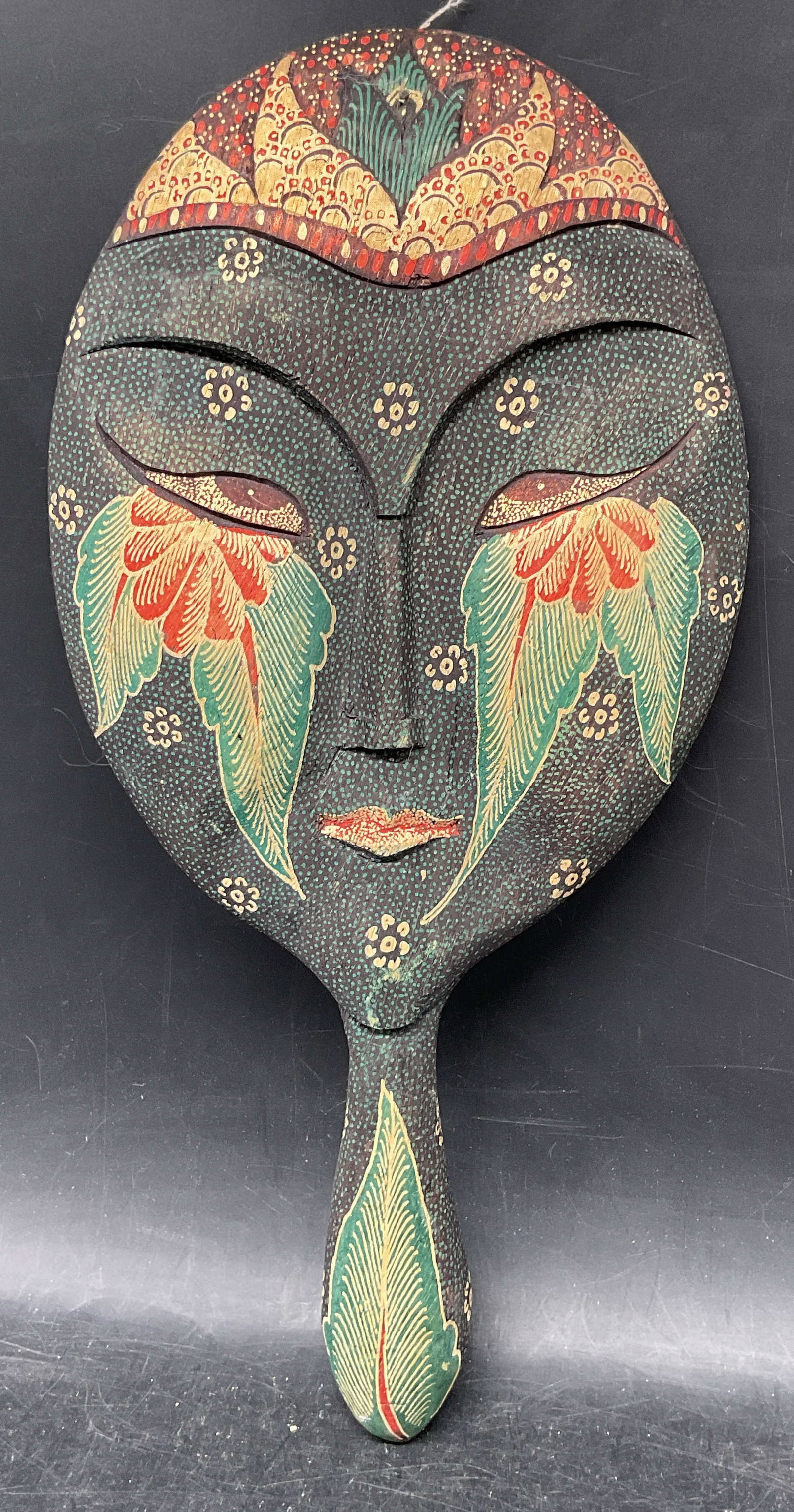 Vintage Hand Painted Carved Face Mirror: Vintage hand mirror. Carved face design. Hand painted with floral detail. Measures approx. 13 x 6.25 inches. Wear including scratching. Mirror, hand mirror, face mirror, collectibles, home decor, home