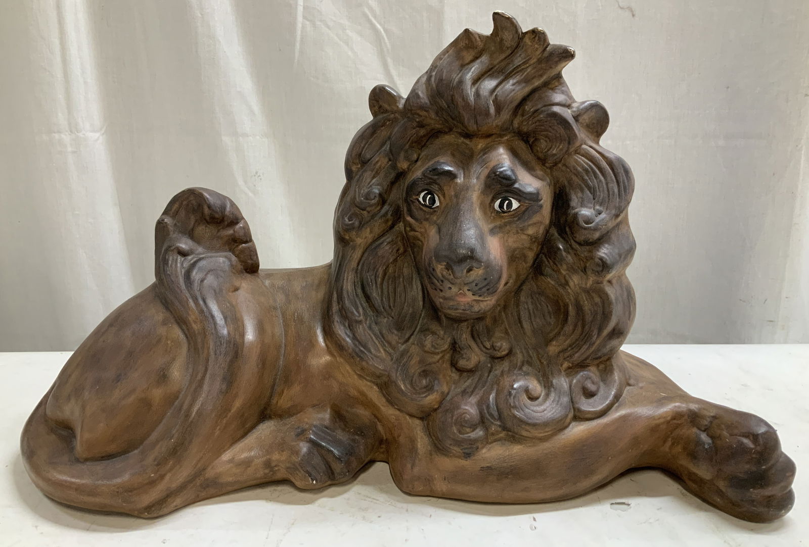 Vtg Ceramic Laying Lion Statue 17.5in L: Vintage ceramic lion statue in a laying position & features a brown finish. Hand painted details. Surface wear consistent to age, use & exposure. No visible signature or markings. Measurements: length