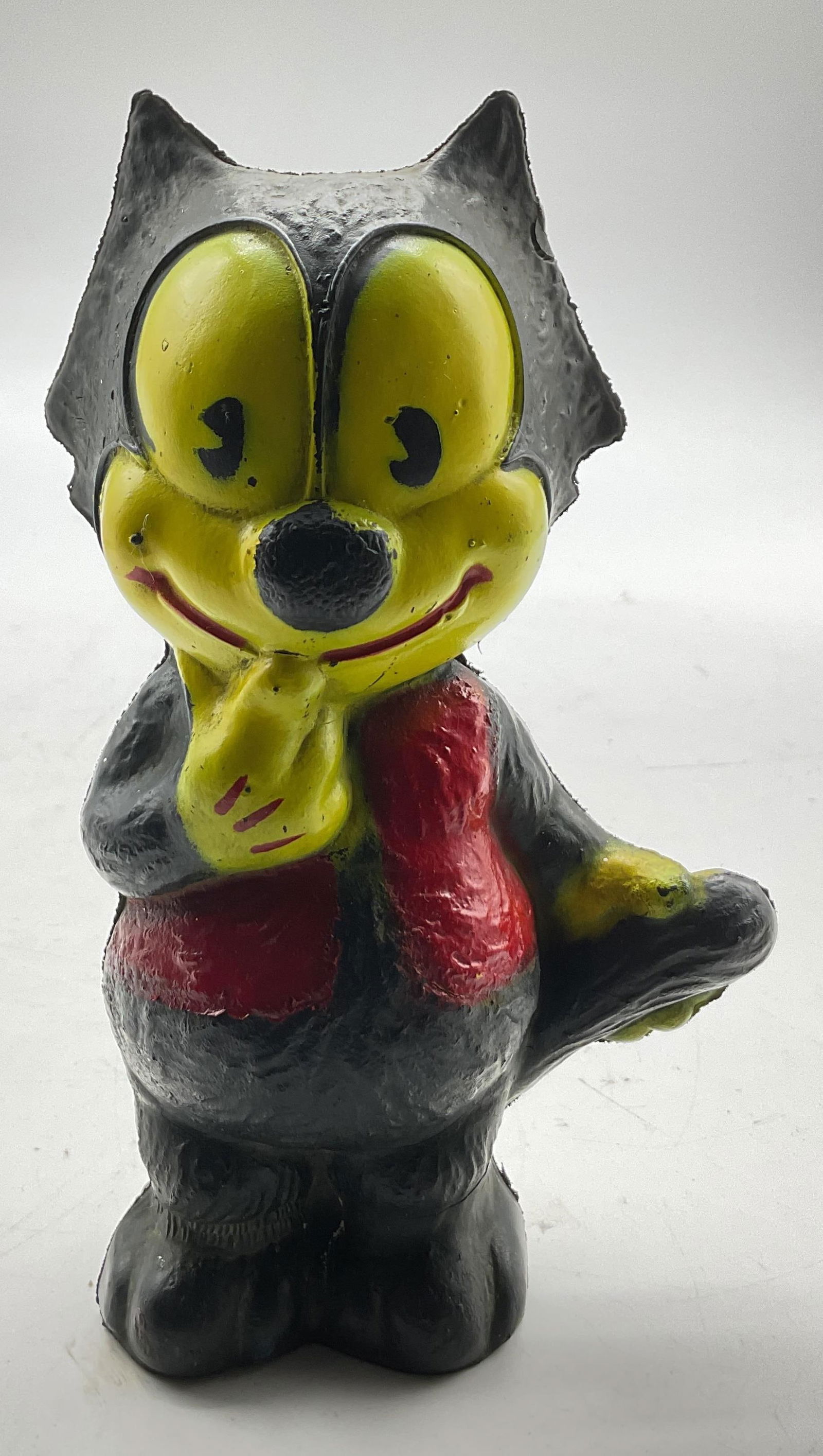 1962 Felix The Cat Squeak Rubber Toy Irwin USA: 1962 Felix The Cat squeak toy. Mid century rubber toy. Made in Irwin USA. Standing pose with one paw on face and other on tail. Detailed features and textures. Yellow, black, and red. Measures approx