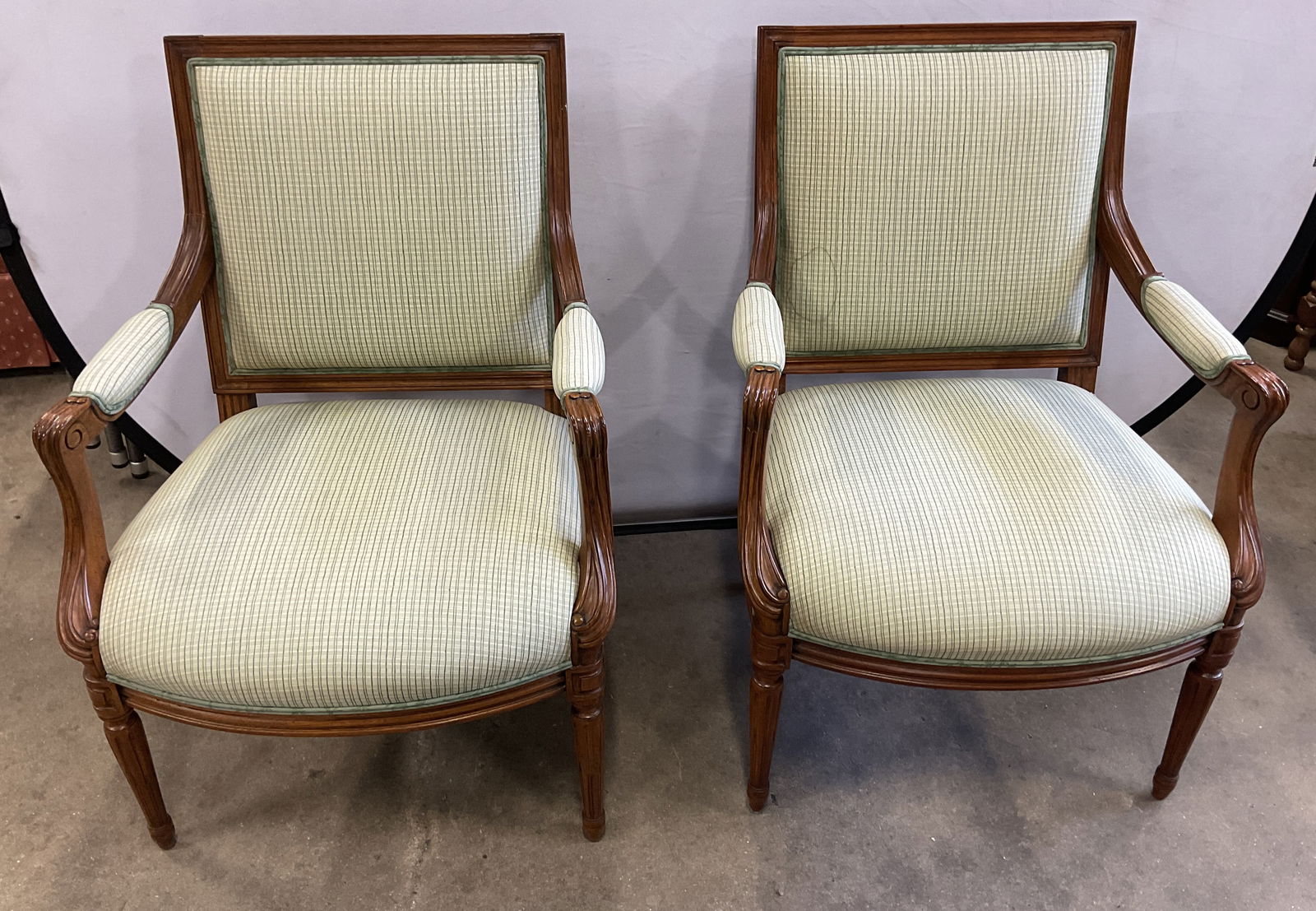 Pair Pierre Deux French Country Green Armchairs: Pair of Pierre Deux French country style wood frame armchairs with green upholstery. Carved legs and arm details. Signed. Measures approx. 26 x 20.5 x 36 inches. wear including discoloration and scrat