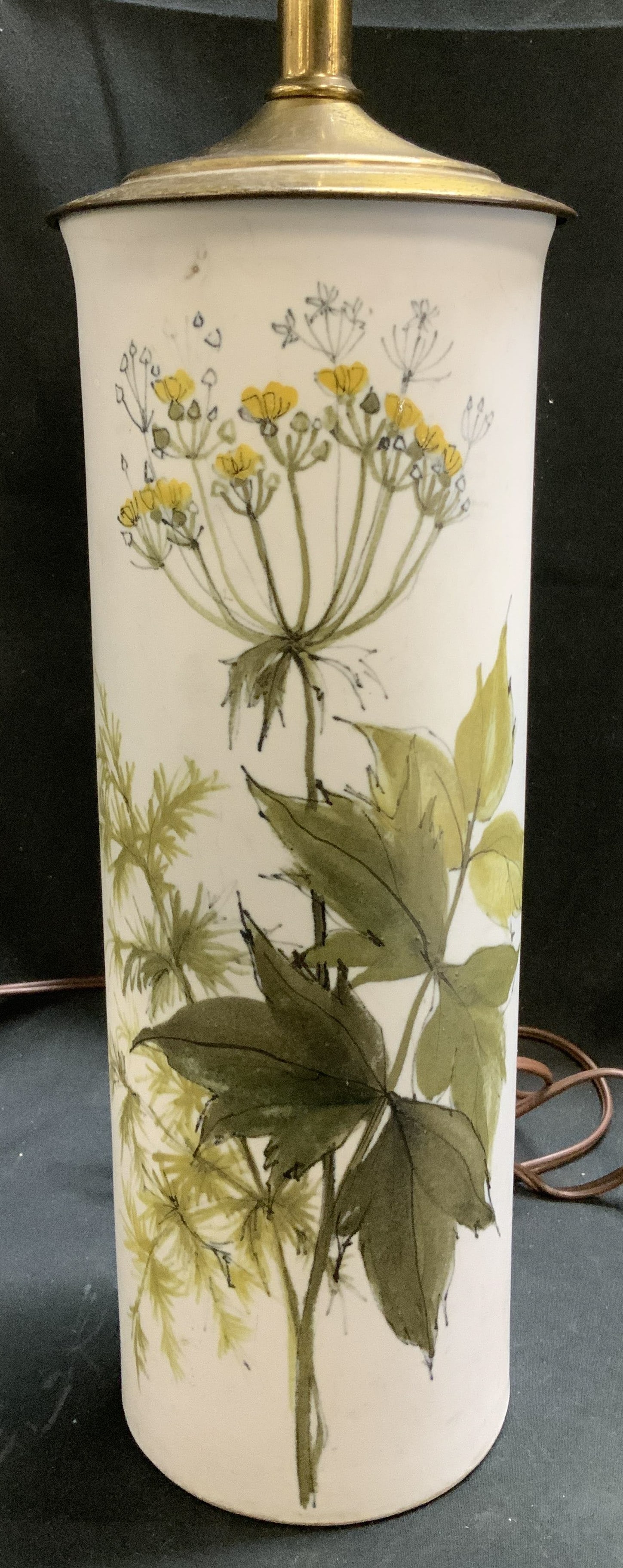 Vtg Hand Painted Floral Ceramic Table Lamp: Lot includes, a vintage ceramic table lamp featuring hand painted floral & leaf accents. Shades of yellow, & green. White background. Table lamp has not been tested for function. Sold as is.