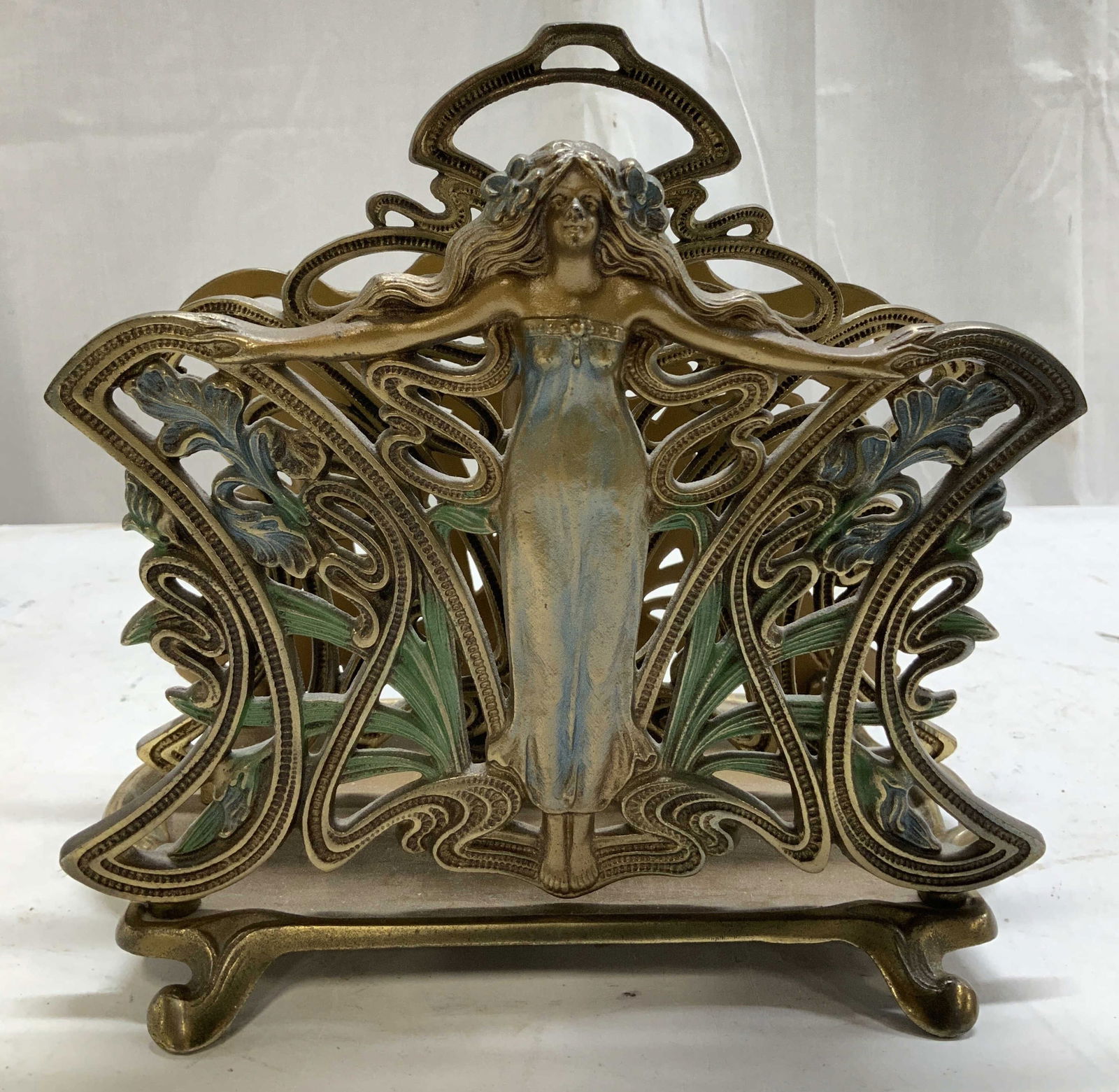 Antq Art Nouveau Brass Letter Holder: Appears to be antique. Art nouveau brass letter holder featuring a female figure with outstretched arms. Leaf motifs. Blue & green accents. Piece has weight. No visible signature or markings. Measurem