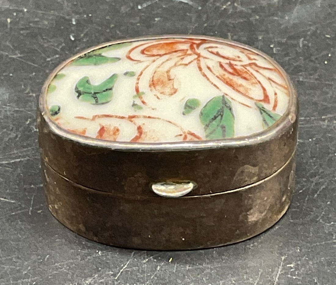 Vtg Sterling Silver & Porcelain Trinket Box: Vintage sterling silver trinket box with porcelain lid. Hand painted floral motif. Marked sterling. Measures approx. 1 3/8 x 1 1/8 x .75 inches. Total weight 20.9 grams. Wear including patina,