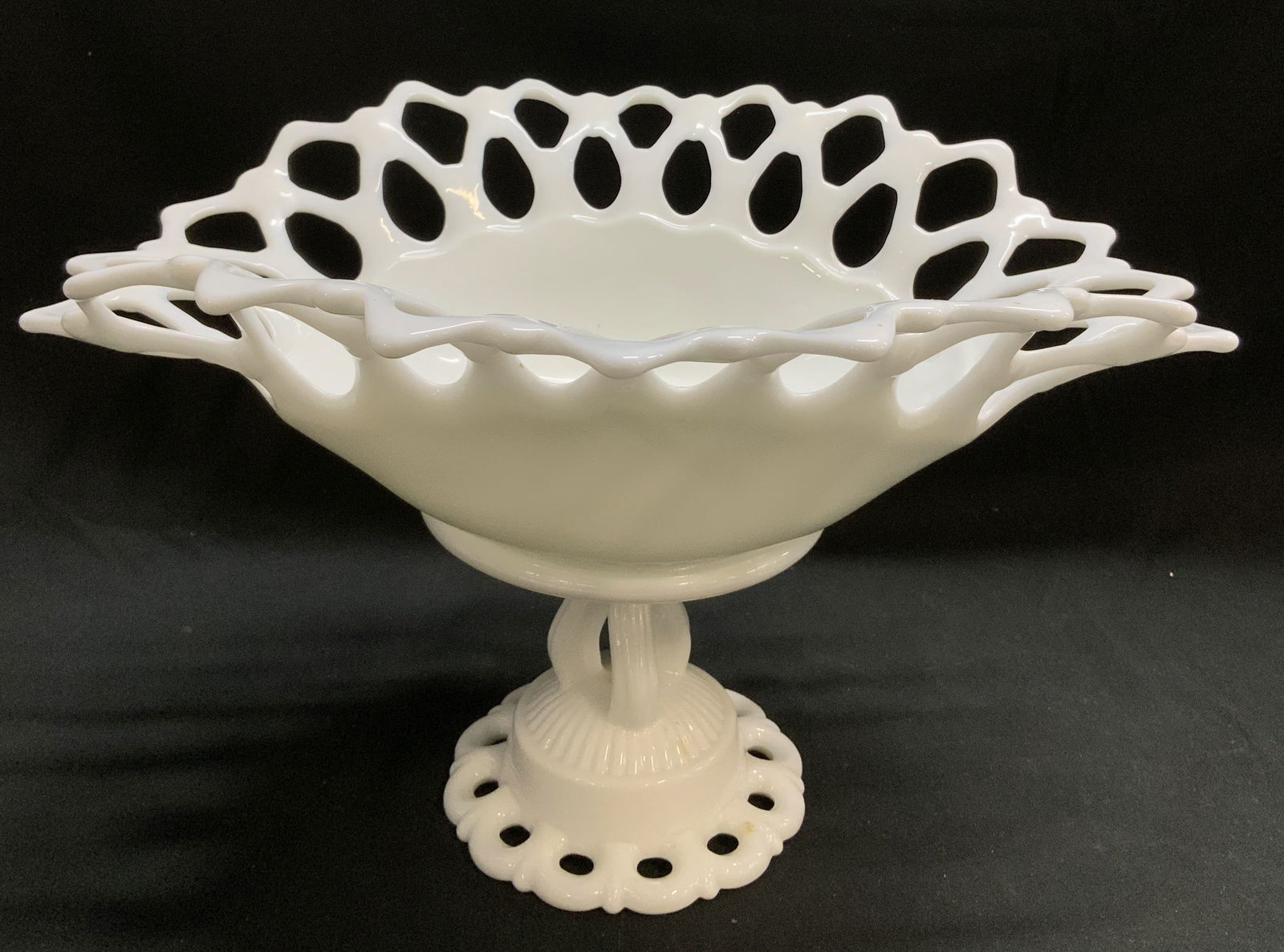 Vtg Westmoreland Milk Glass Pedestal Bowl: Vintage Westmoreland milk glass pedestal bowl, features a distinctive openwork rim. Pedestal base. Surface wear consistent to age, use & exposure. Signed & marked on underside. Visible W. Measurements