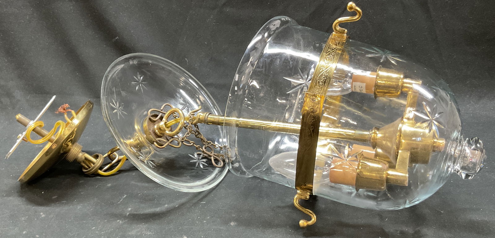 Vtg Brass & Glass Hanging Lantern Light Fixture: Vintage brass and glass hanging lantern light fixture. Bell shaped shade. Etched star motifs. Decorative finial. Candelabra style bulb sockets. Floral and scroll motifs. Gilt accents. Measures approx