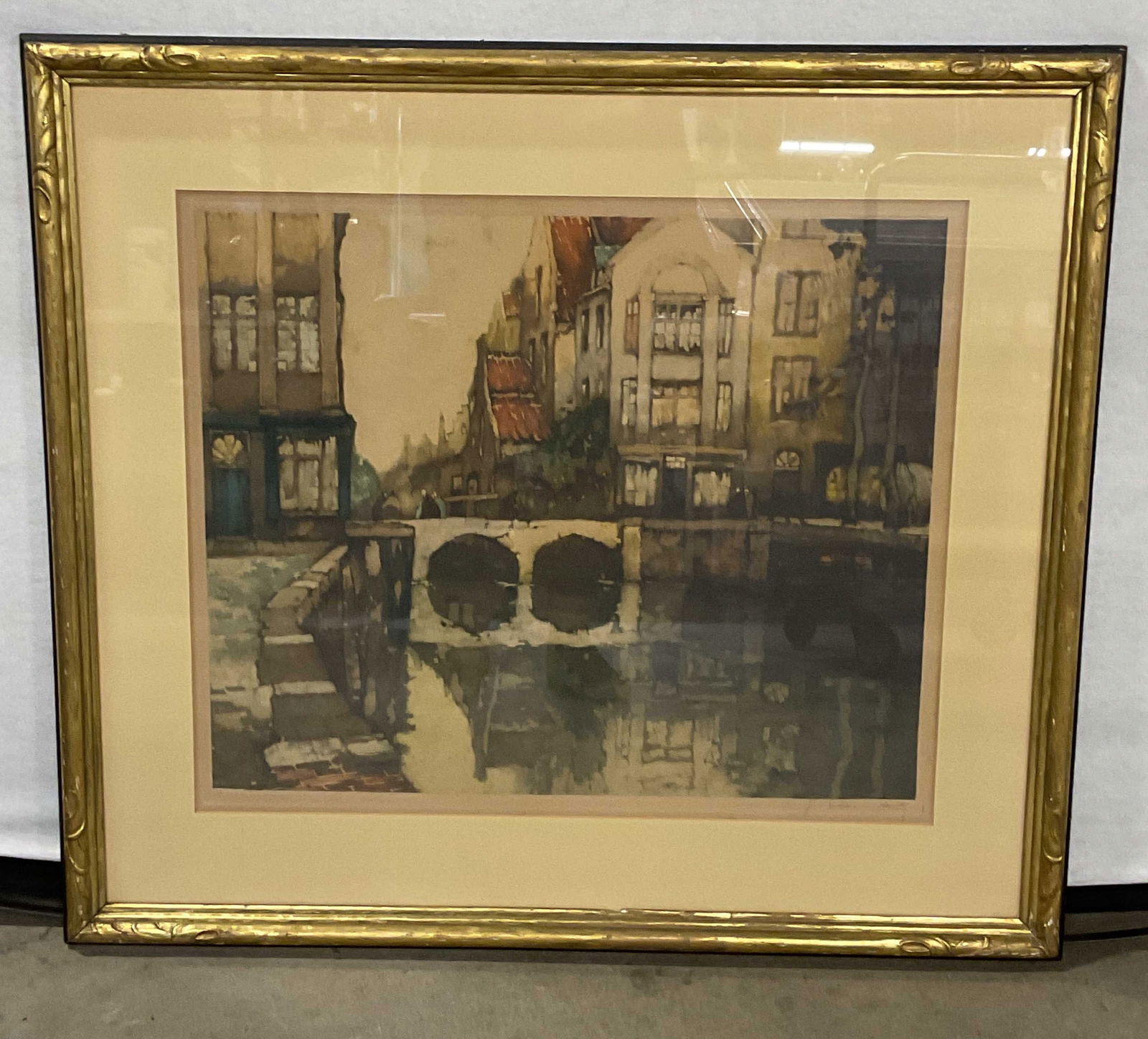 Signed Julian Van Santen Canal Scene Print: Framed and matted fine art print. Signed on the margin Julian Van Santen (c. 1893-1936). European canal scene. Copyright Les Gravures Modernes, 1924. Medium possibly color etching or lithograph. Gilt