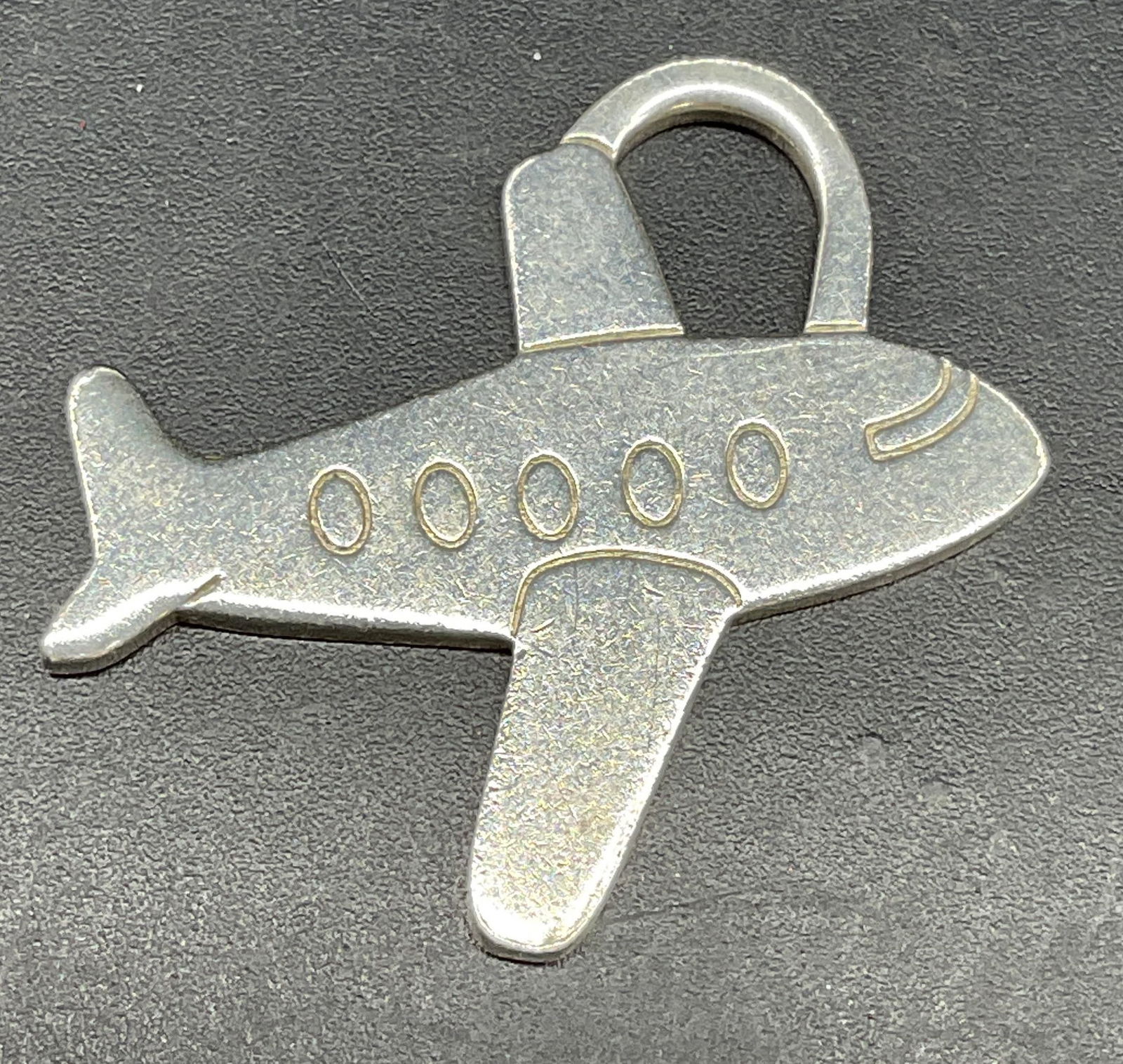 Tiffany & Co Sterling Silver Airplane Pendant: Signed Tiffany & Co Sterling silver airplane pendant. Measures approx. 1.25 x 1.25 inches. Marked sterling. Total weight 4.9 grams. Some scratching. Jewelry, estate jewelry, fine jewelry, cocktail jew