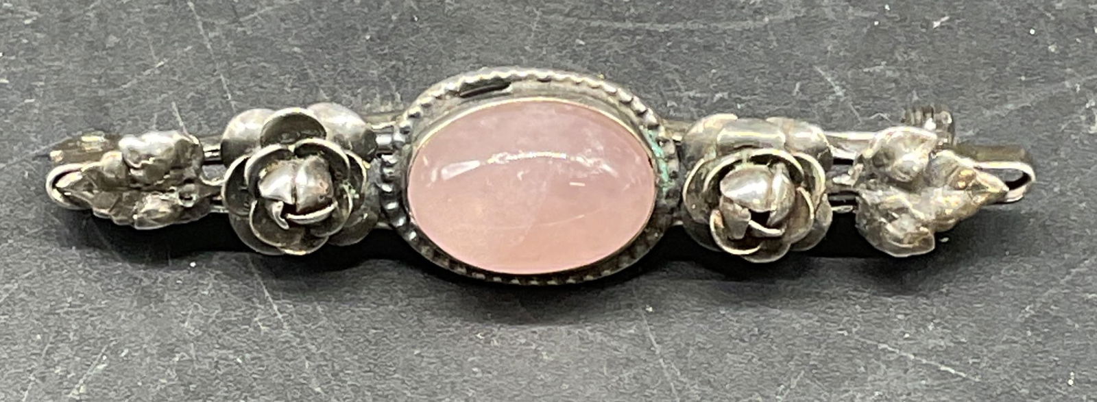 Sterling Silver Semiprecious Brooch, Germany: Vintage sterling silver and pink semiprecious cabochon brooch. Made in Germany. Measures approx. 2 inches long. Total weight 5.1 grams. Marked sterling. Some scratching. Jewelry, estate jewelry, fine