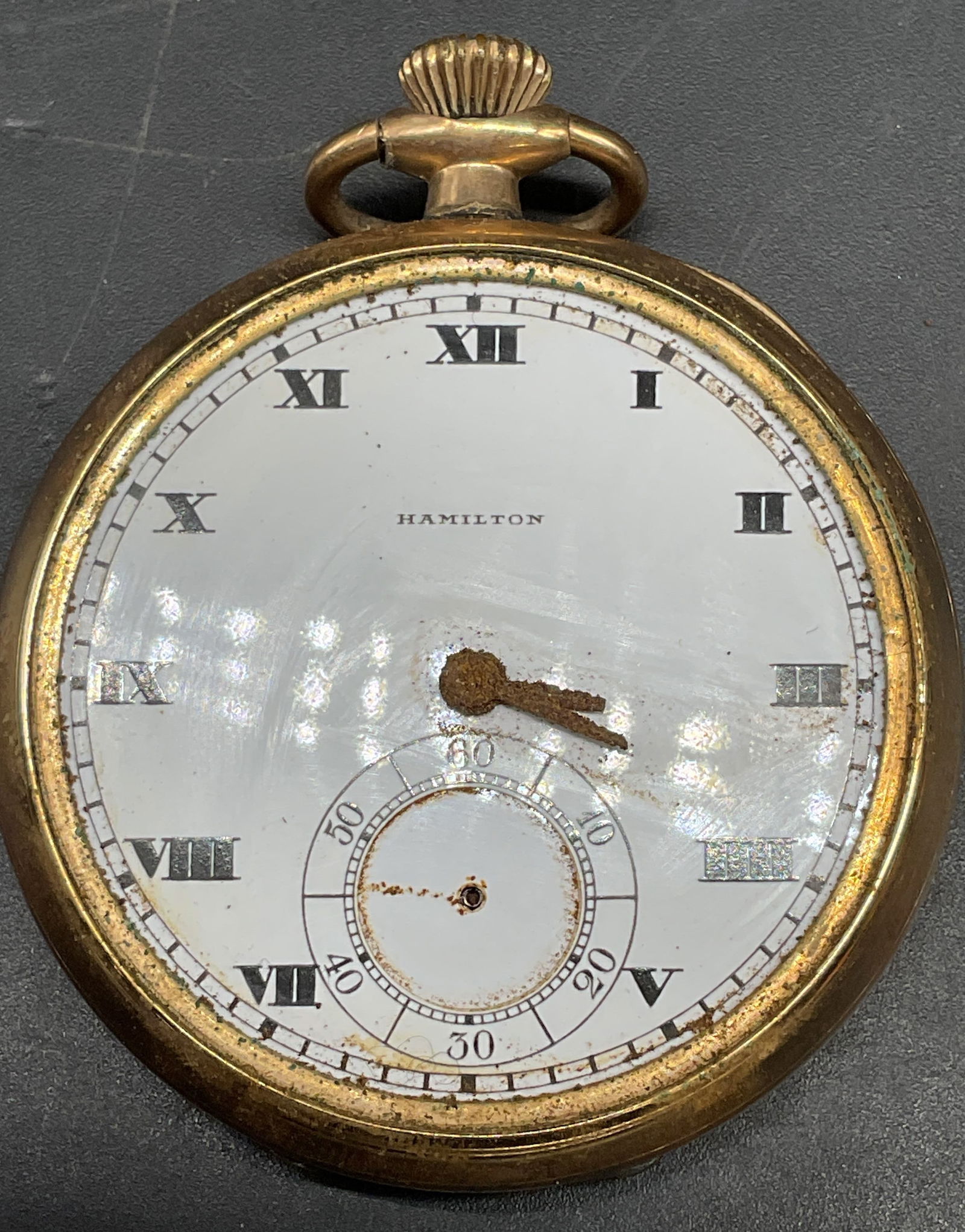Antique Hamilton Gold Plated Pocket Watch: Antique Hamilton gold plated pocket watch. Movement serial number 1871270. Measures approx. 1.75 inches wide. Includes a wood and acrylic cloche stand. Not tested. Dial cover and hands need replacemen