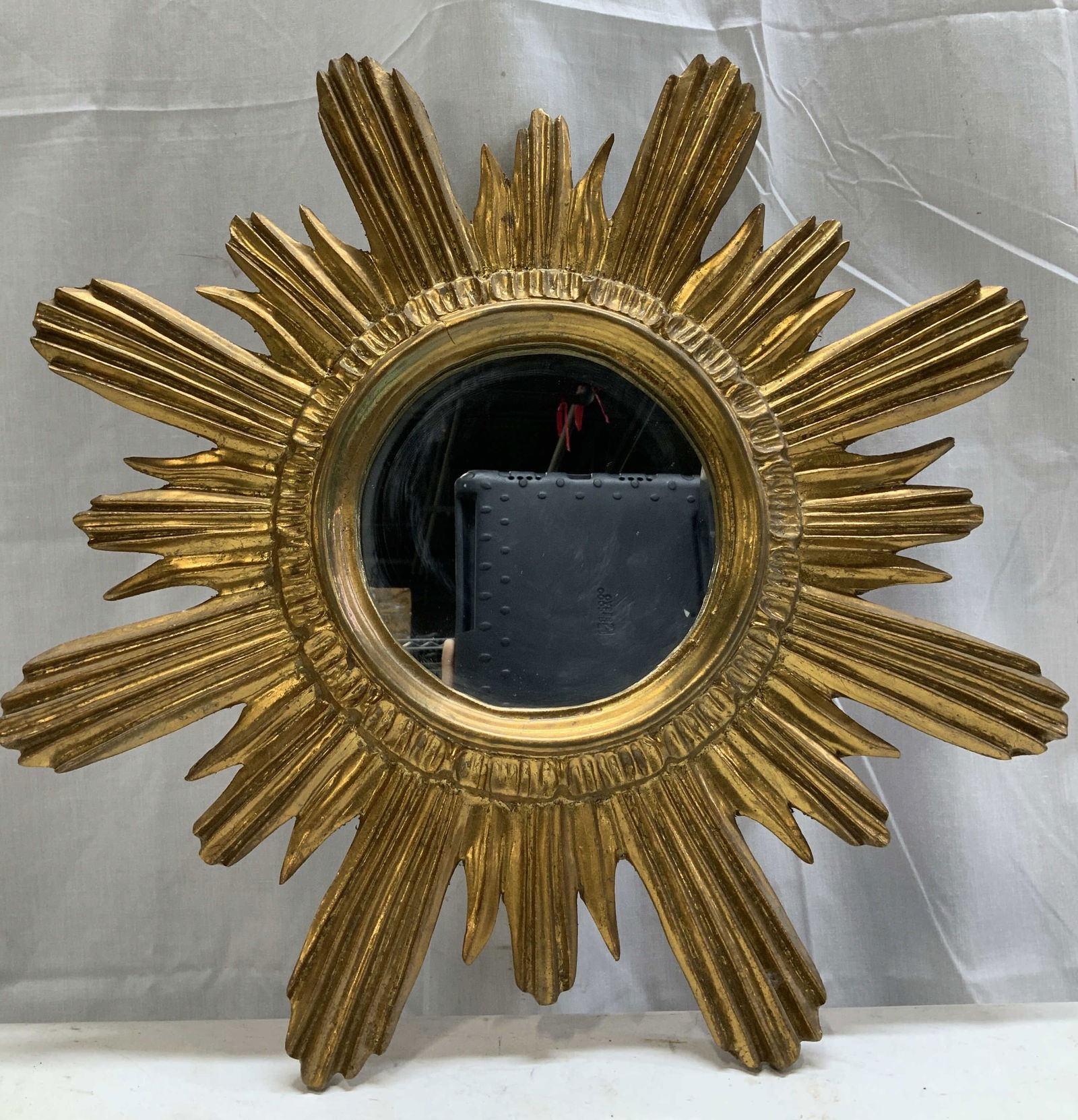 Vtg Handmade Giltwood Wall Mirror ITALY: Vintage handmade Giltwood wall mirror featuring a sunburst style. Underside has a red velvet backing. Signed & marked on underside. Reads, HAND MADE IN ITALY. ITALIA. Surface wear consistent to age, u