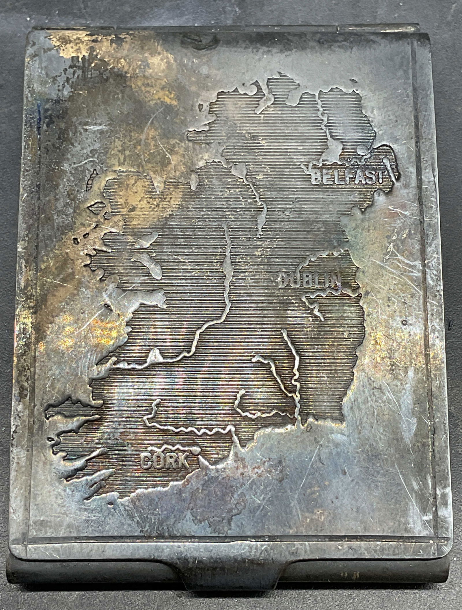 Vtg Silver Plated Ireland Map Match Strike Safe: Vintage silver plated match strike safe with etched map on Ireland on cover. Made in Ireland. Measures approx. 2.25 x 1 5/8 inches. Wear including patina and scratching. Silver plated match safe, silv