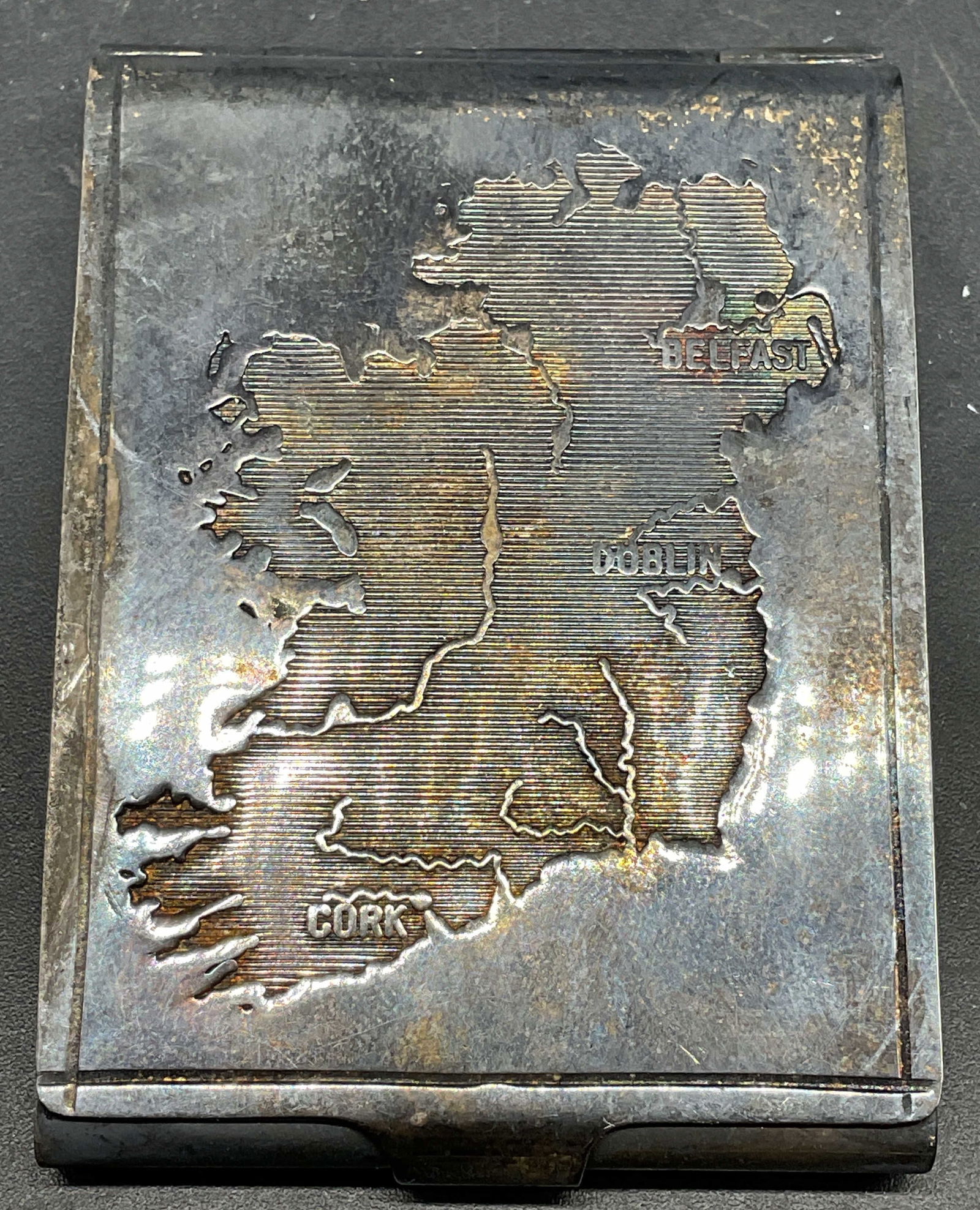 Vtg Silver Plated Ireland Map Match Strike Safe: Vintage silver plated match strike safe with etched map on Ireland on cover. Made in Ireland. Measures approx. 2.25 x 1 5/8 inches. Wear including patina and scratching. Silver plated match safe, silv