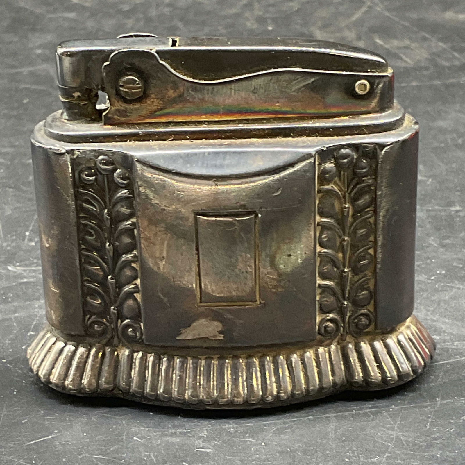 Vtg Ronson Diana Silver Pl Table Lighter: Vintage circa 1940s/50s signed Ronson Diana silver plated table lighter. Ornate botanical scroll design. Measures approx. 2 3/8 x 2 1/8 inches. Some scratching and patina. RONSON lighter, RONSON Diana