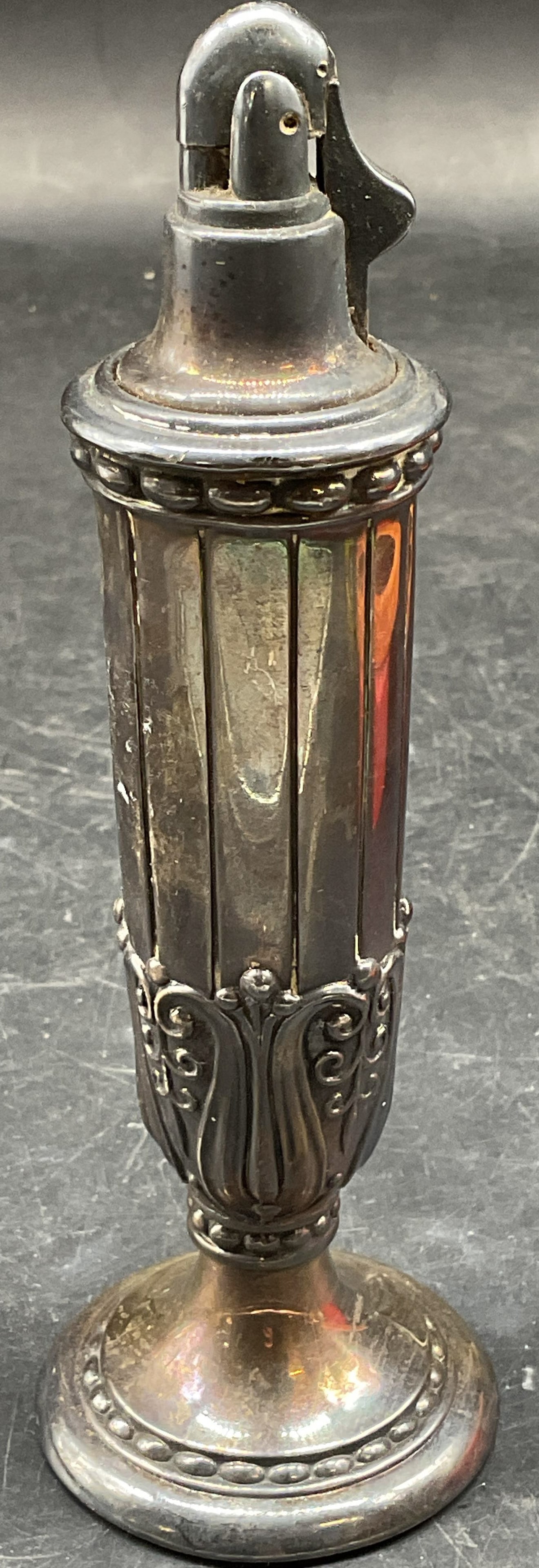 Vtg Ronson Juno Silver Pl Table Lighter: Vintage circa 1950s signed Ronson Juno silver plated table lighter. Tall ornate urn shape. Measures approx. 2 x 6.25 inches. Some scratching and patina. RONSON lighter, Juno lighter, table lighter, vi