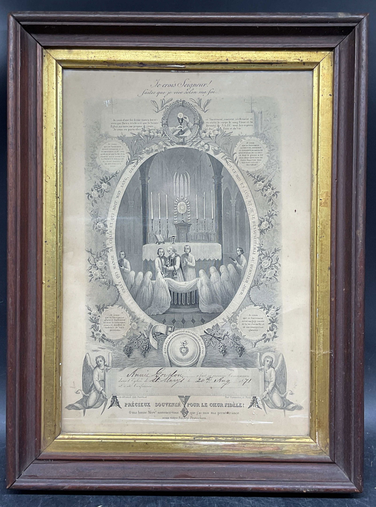 Framed 1871 French First Communion Certificate: Framed antique French first communion religious certificate. Printed text with religious imagery and hand written inscriptions. Dated 1871. Wood frame with gilt border. Not examined out of frame.