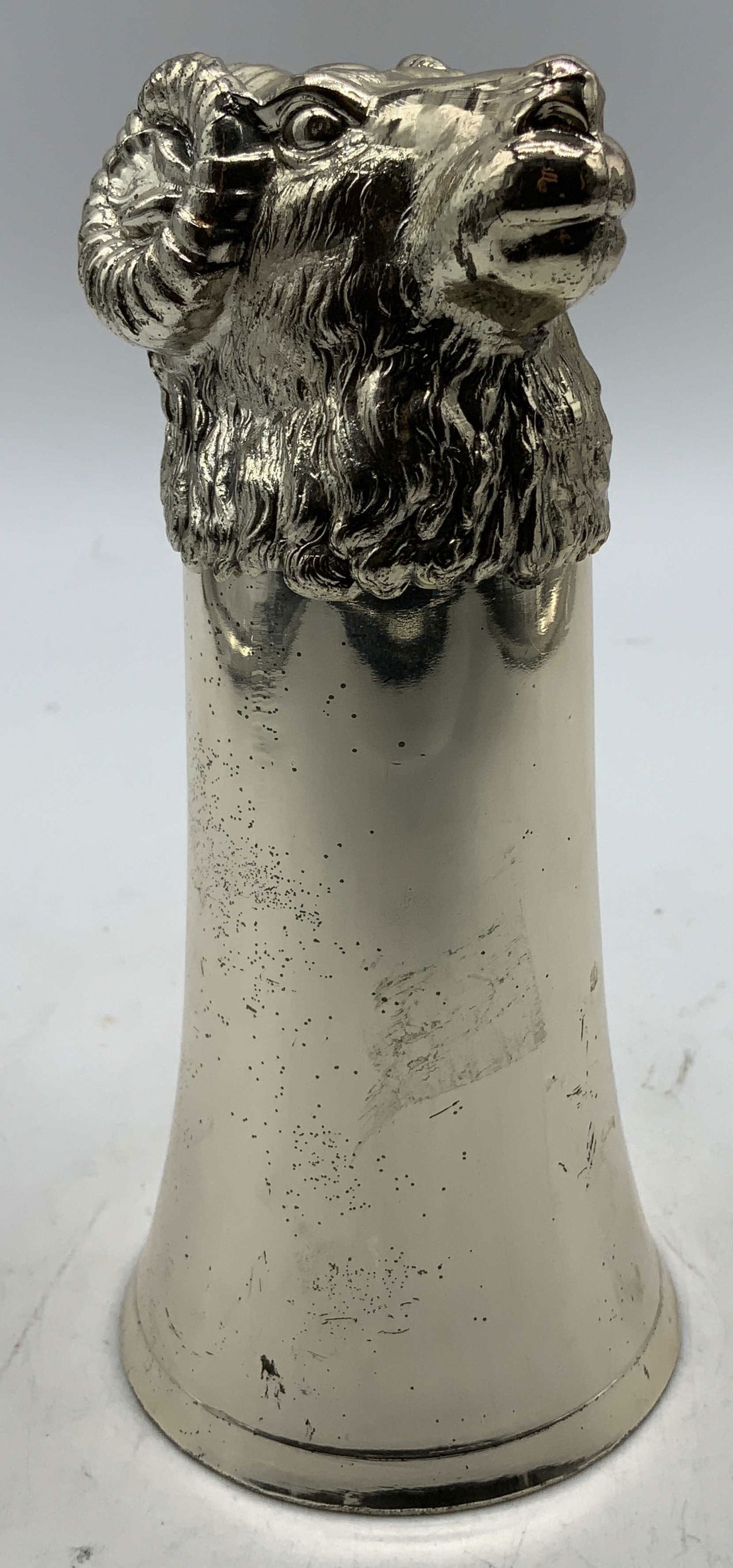 Vtg Silver Plated Rams Head Stirrup Cup: Vintage silver plated stirrup, features a rams head at top. Curled horns & intricate detailing. Interior has a gold wash interior. Surface wear consistent to age, use & exposure. Measurements: