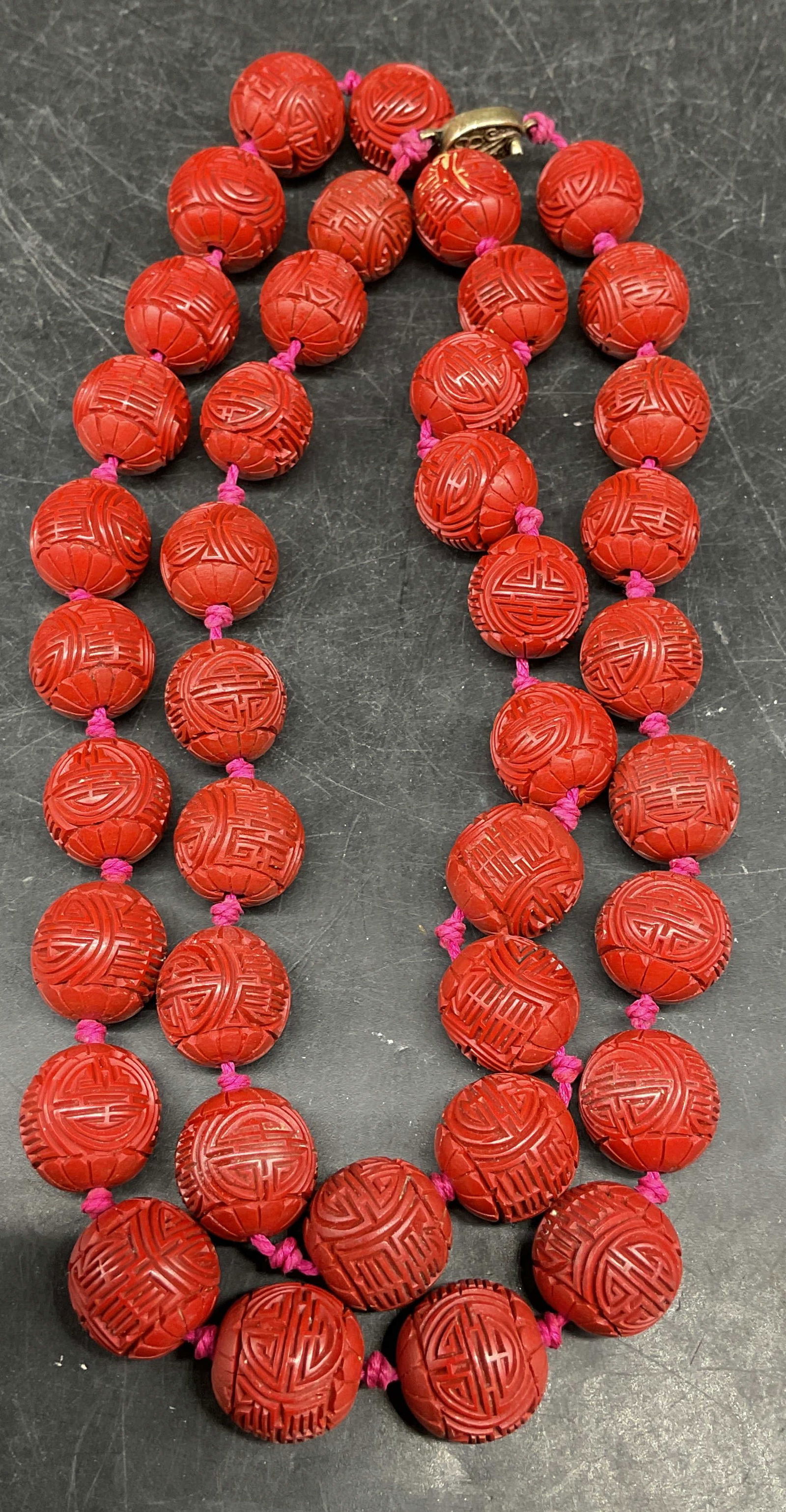 Vintage Chinese Carved Lacquer Beaded Necklace: Vintage Chinese red carved lacquer beaded necklace with silver clasp. Marked silver. Drop length approx 15 inches. Some scratching. Jewelry, estate jewelry, costume jewelry, cocktail jewelry, fashion