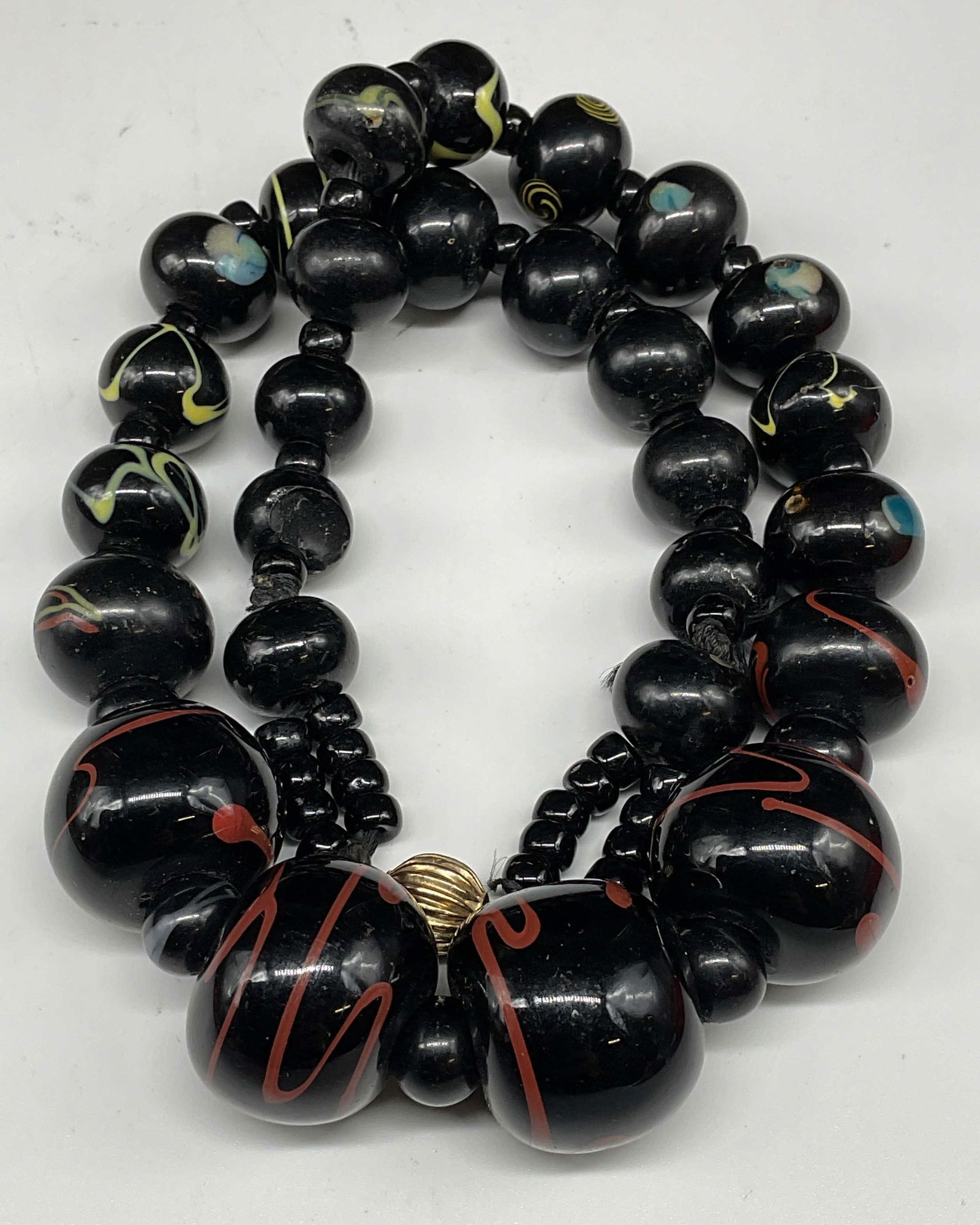 Vintage 14k Gold Black Beaded Necklace: Vintage chunky black beaded swirl necklace with 14k gold clasp. Marked 14k. Drop length approx 9 inches. Some scratching. Jewelry, estate jewelry, costume jewelry, cocktail jewelry, fashion jewelry, a