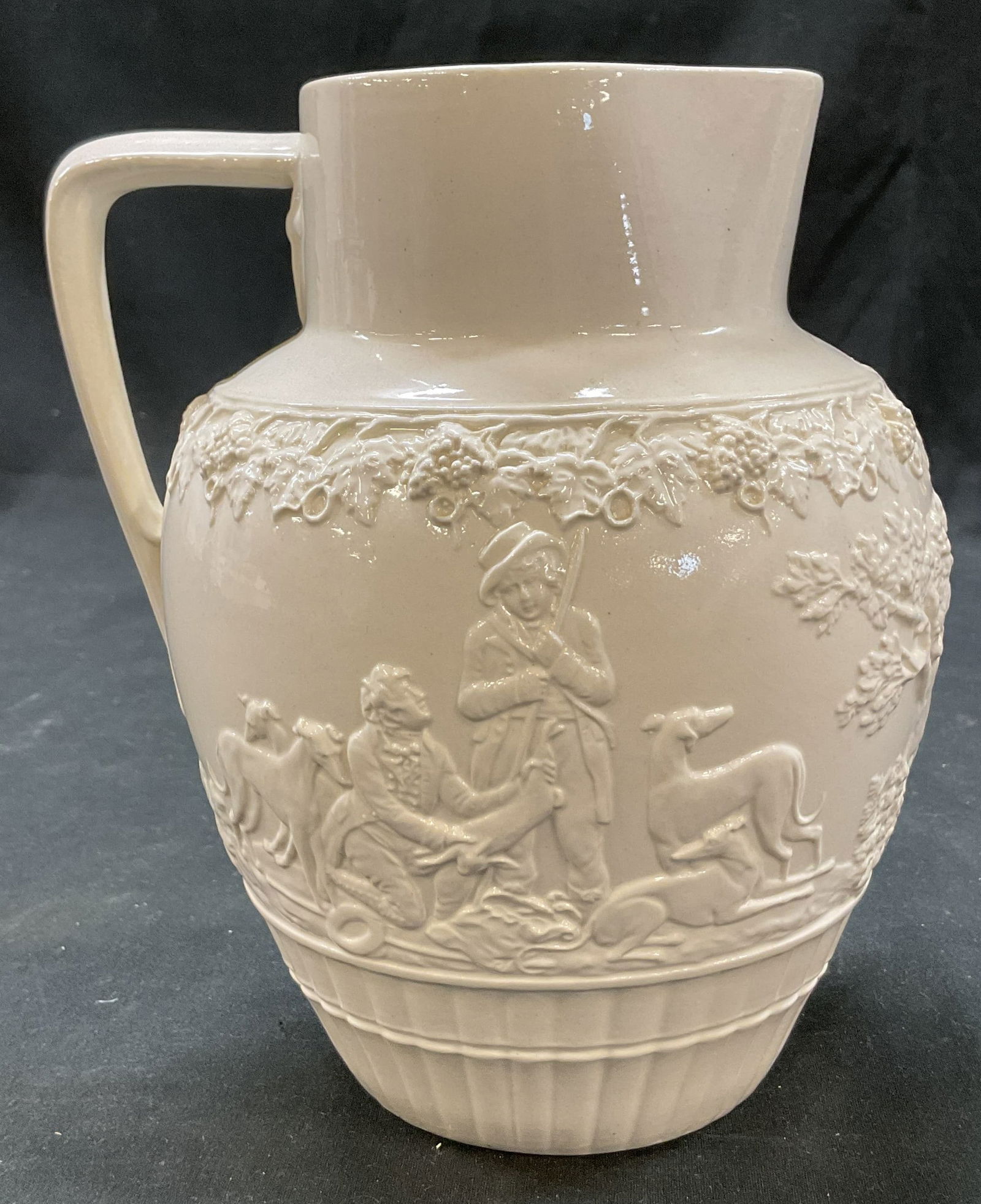 Minton 18thC Staffordshire Salt Glaze Pitcher Engl: Minton 18th century Staffordshire ceramic salt glaze pitcher. Signed on underside, reads Minton Est 1793 England 18th Cent Staffordshire Salt Glaze. Wide rim and curved handle. Embossed design featuri