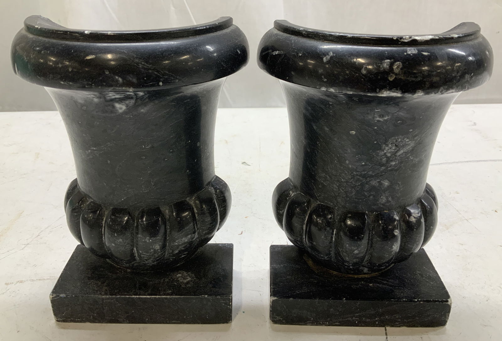 Pair Vtg Black Stone Urn Bookends ITALY: Lot includes, a pair of vintage bookends featuring an urn form style. Stands on square base. Appears to be possible stone or marble material. Signed & marked on underside. Reads, 0682 ITALY. Surface w