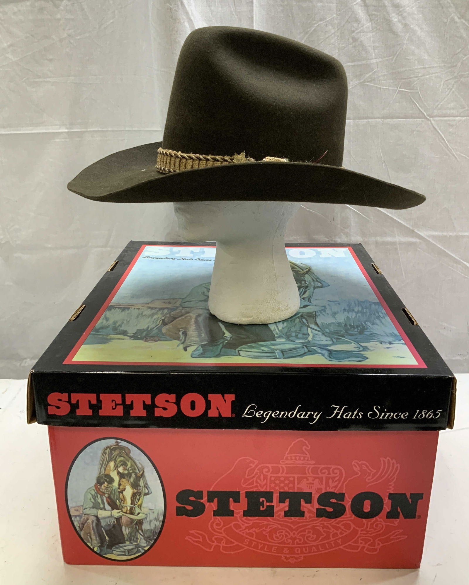 Biltmore Silver Buckle Cowboy Hat W Bx CANADA: Size 7 3/8. 59cm. Lot includes, Biltmore Silver Buckle The New West brown cowboy hat featuring a distinctive braided band. Comes with Stetson box. Signed & marked on underside. Reads, BILTMORE SILVER
