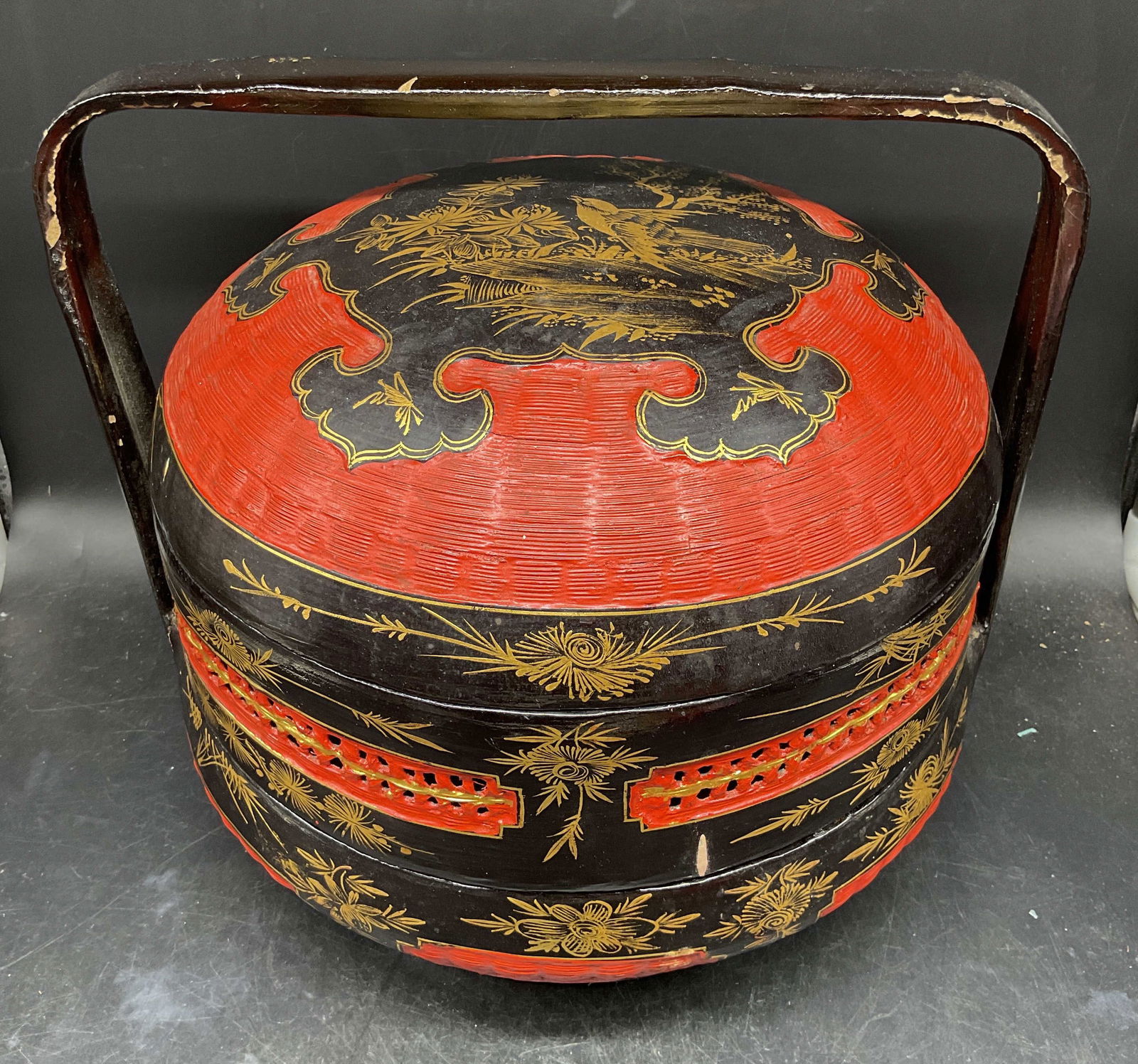 Vintage Chinese Peranakan Wedding Basket: Vintage Chinese Peranakan wedding basket. Two tired basket. Hand painted lacquered wood in red and black with gilt detail. Floral and bird designs. Measures approx. 14 x 12.25 inches. Wear including s