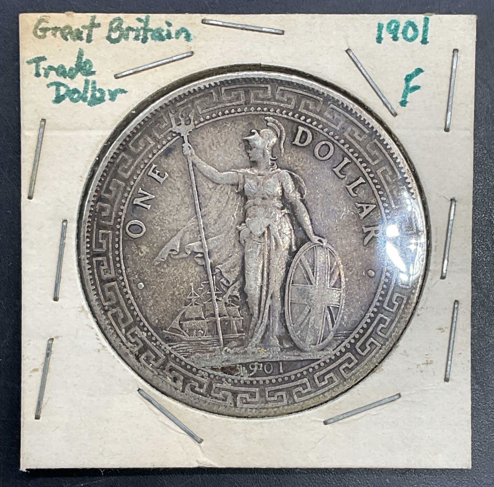 1901 United Kingdom Trade Dollar Coin 900 Silver: 1901 United Kingdom (Great Britain) Trade Dollar. .900 silver. Obverse features Britannia holding trident and shield, reverse features Asian design and text. Minted for use in Asian trade.