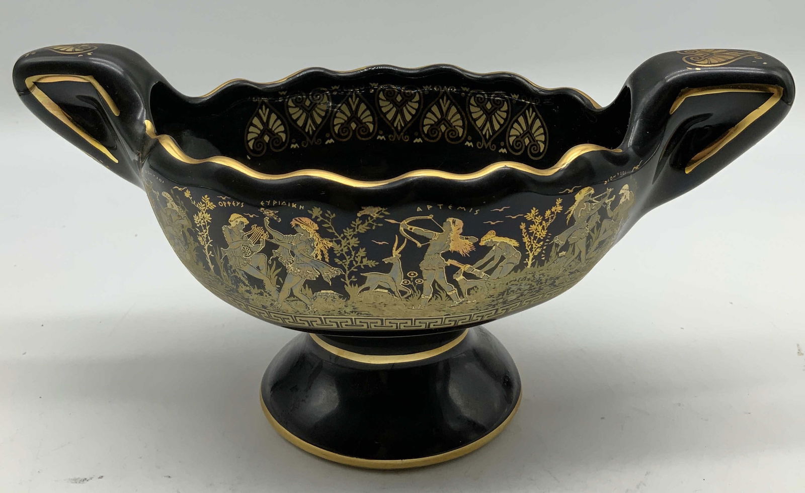 Vtg Hand Made Mythological Figs Footed Bowl GREECE: Vintage ceramic footed bowl features hand-painted mythological scenes & heavy gilt accents. Double handles. Signed & marked on underside. Reads, HAND MADE IN GREECE. IN 24, possibly originally read 24