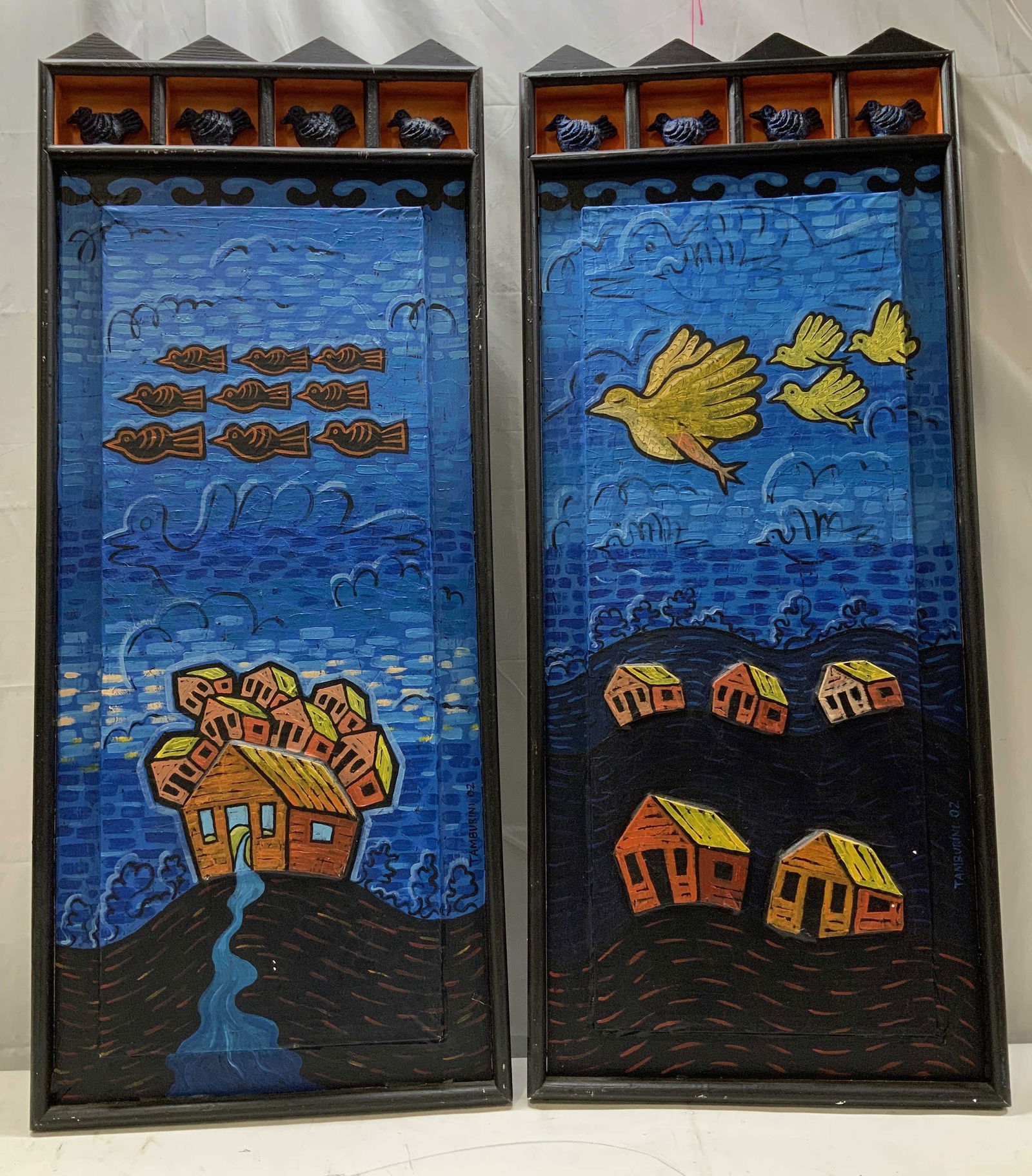 Pair Carved Wood Pastoral Scene Wall Plaques 47in: Lot includes, a pair of carved wood relief wall plaques featuring hand painted pastoral scenes with birds & a house. Right side reads, TAMBURINI 02. Surface wear consistent to age, use & exposure. Mea