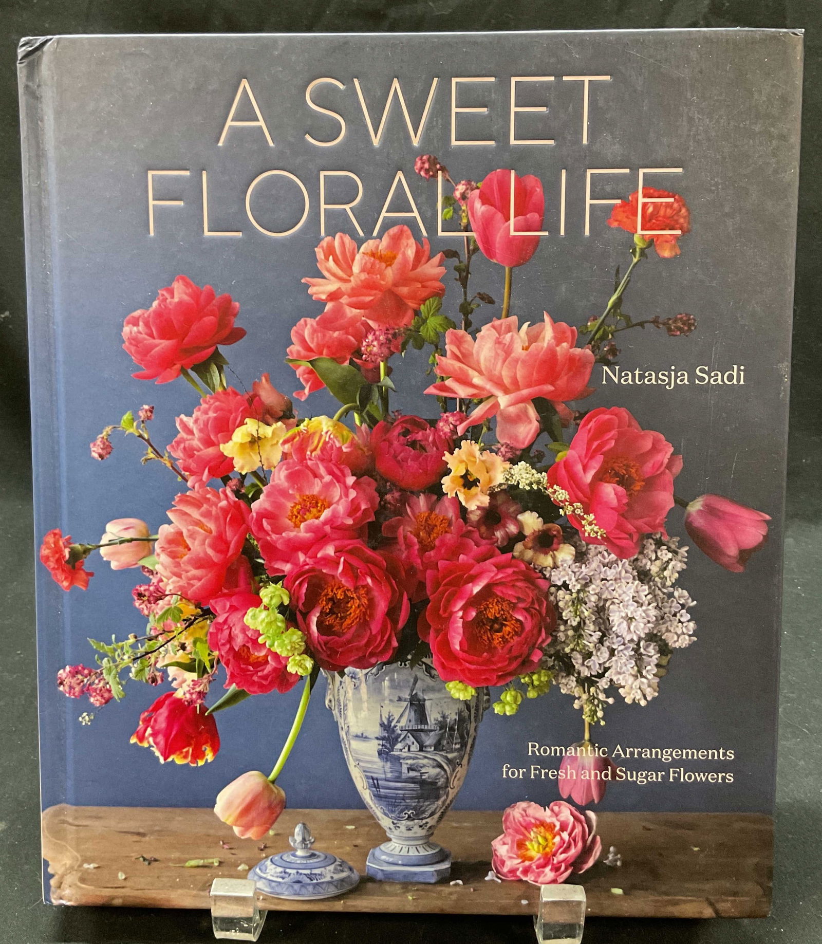 SGND 1st Ed A Sweet Floral Life Sadi Illus Bk 2023: A Sweet Floral Life by Natasja Sadi. Published by Ten Speed Press, 2023. First edition book. Signed by author on inside. Hard cover book with illustrated cover. Includes text and illustrations.