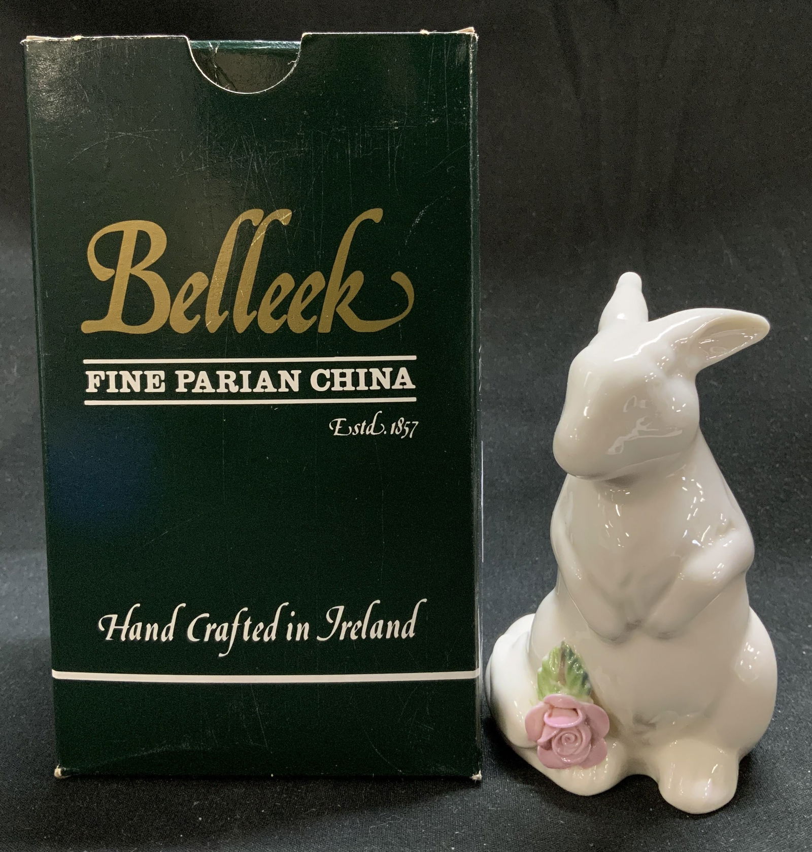 Belleek Floral Treasures Rabbit Fig W Bx IRELAND: Lot includes, Belleek hand crafted rabbit figurine with a pink floral accents. Glossy finish. Comes with original box. Signed & marked. Reads, BELLEEK. FINE PARIAN CHINA. HANDCRAFTED IN IRELAND. Surfa