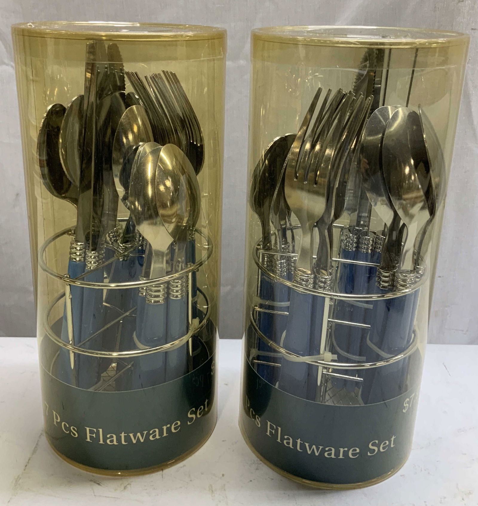 Lot 34 RTH 2017 Flatware Set W Org Box NIB: Lot includes, 2 new in box round the house (RTH) 17 pcs flatware set. Includes 4 dinner spoons, 4 dinner forks, 4 dinner knives, 4 tea spoons & 1 wire holder. Lot is sold as is. Surface wear consisten