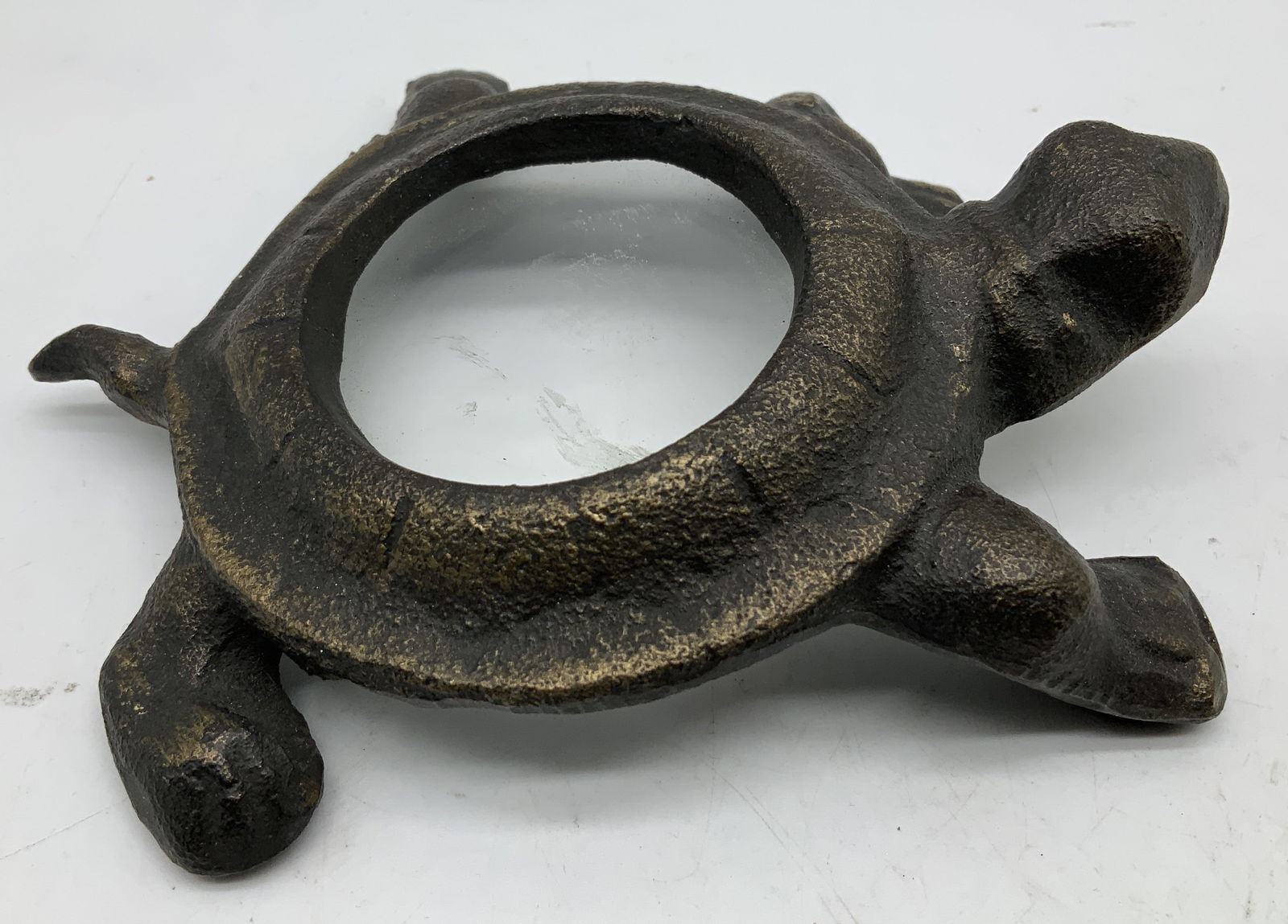 SPI Gilt Cast Iron Turtle Desk Magnifying Glass: Desk magnifying glass is shaped like a turtle & shell features a glass lens. Gilt cast iron material. Signed & marked on underside. Reads, SPI SAN PACIFIC INTL. USA. Surface wear consistent to age, us