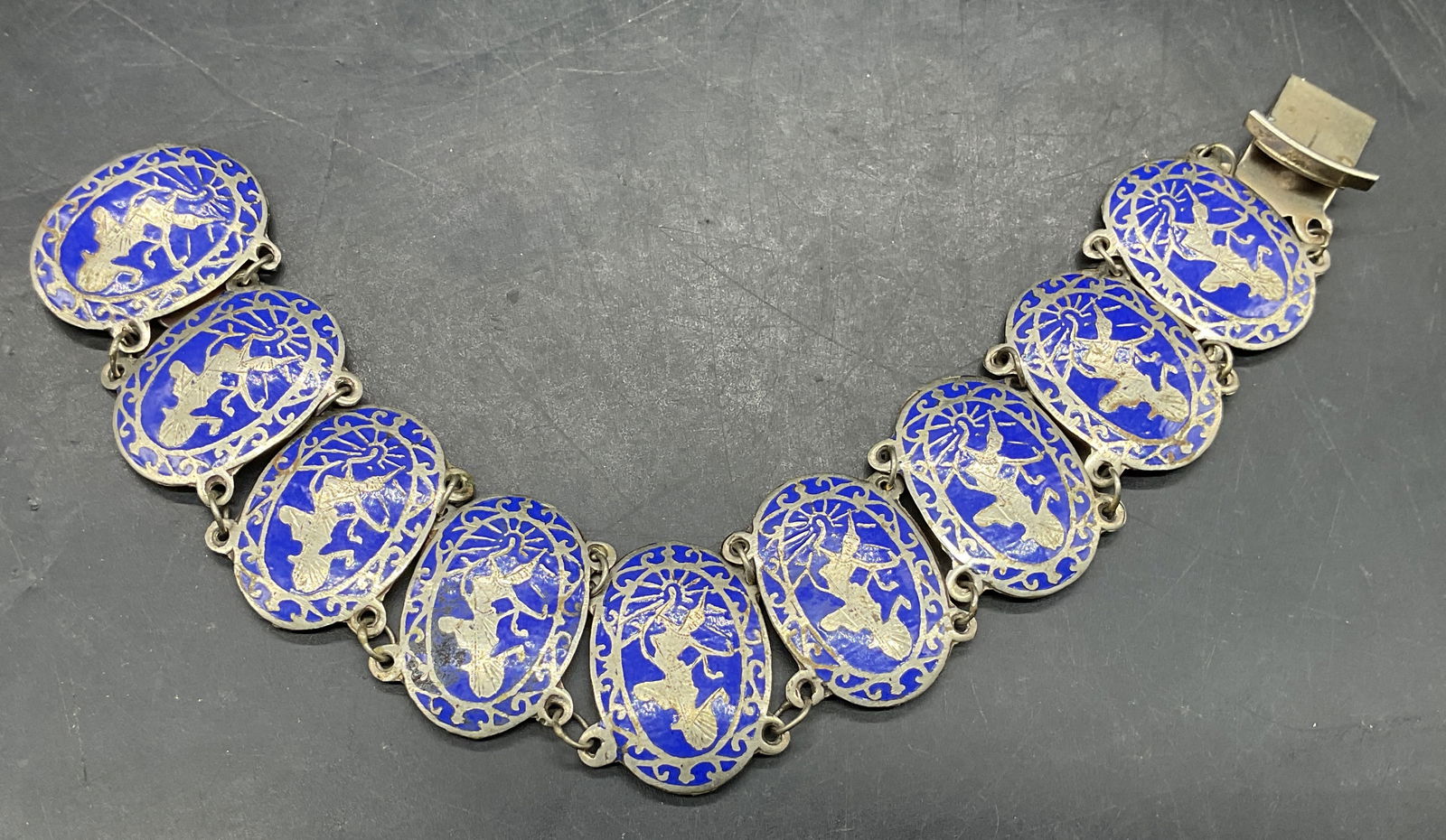 Vintage Sterling Silver Enamel Thai Bracelet: Vintage Sterling silver blue enamel Thai bracelet. Marked sterling, Siam. Measures approx 7 inches long. Total weight 20 grams. Some scratching. Jewelry, estate jewelry, fine jewelry, cocktail jewelry