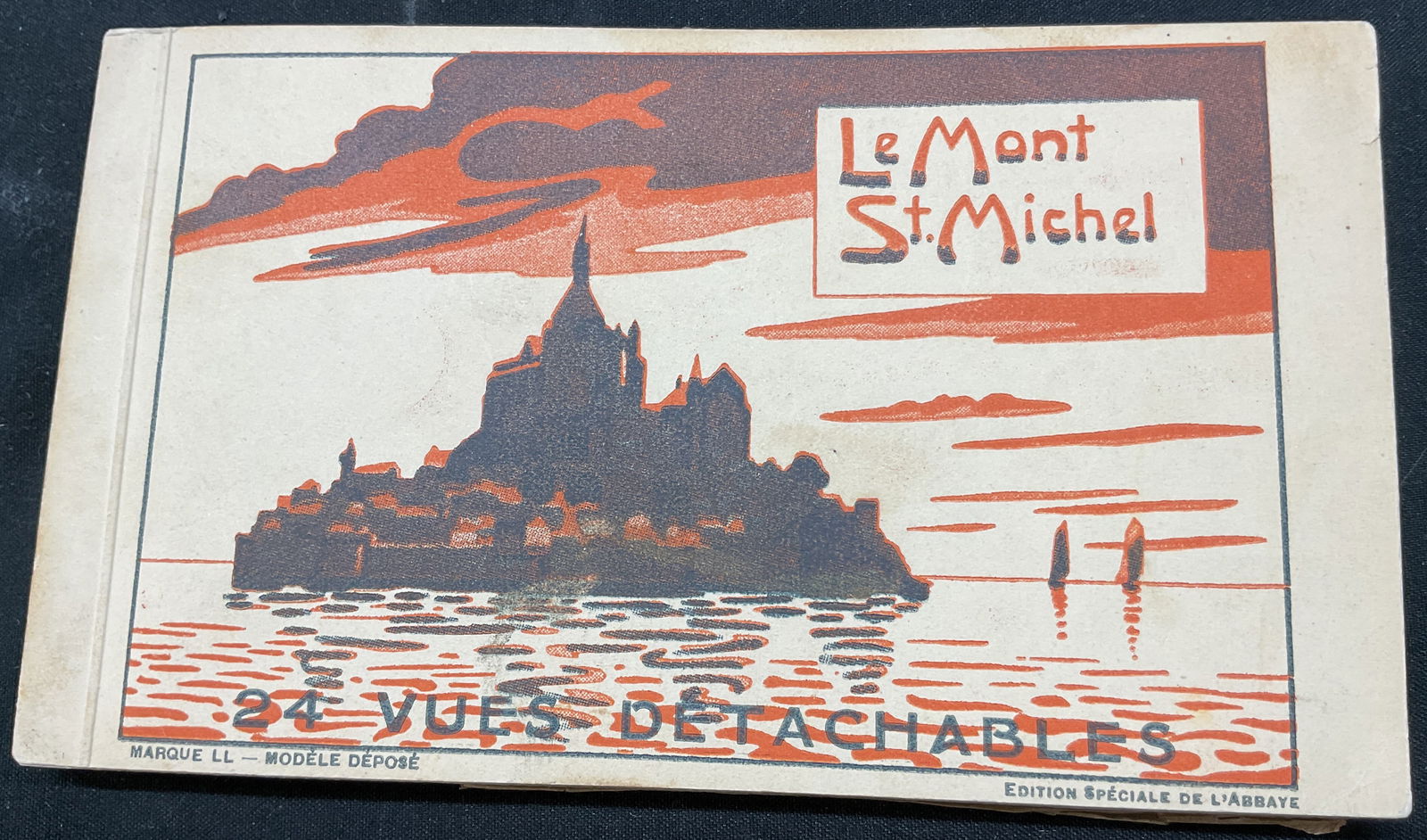 Le Mont St Michel Postcard Booklet: Le Mont St Michel postcard booklet. Features Le Cote Sud et la Digue, Les Remparts de lAbbaye, LEscalier de dentelle en granit, and more. Measures approx 3 1/2 x 6 inches. Surface wear consistent