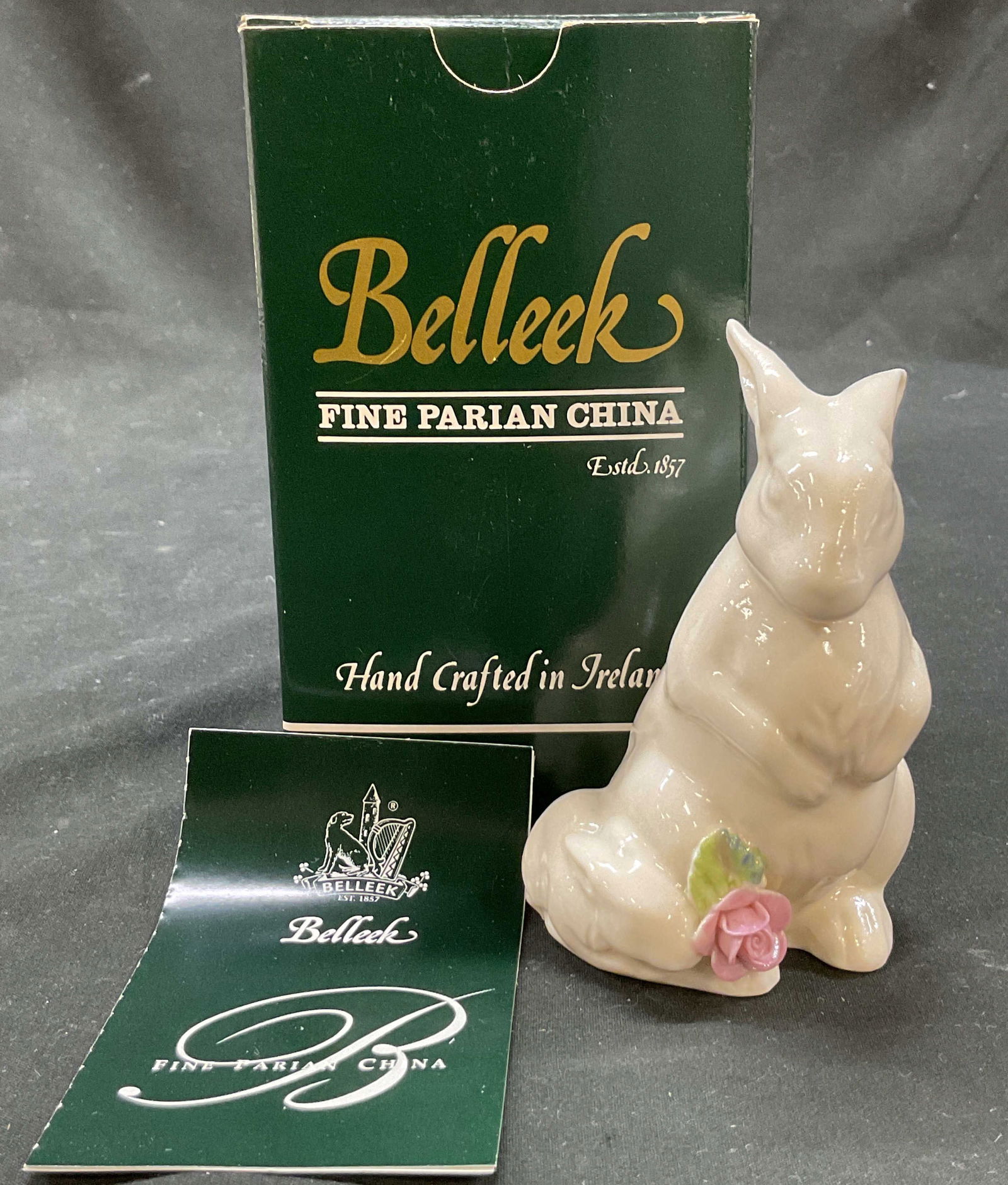 Belleek Floral Treasures Rabbit Fig Ireland NIB: New in box. Belleek Fine Parian China Floral Treasures rabbit figurine. Hand crafted in Ireland. Marked on underside, reads Floral Treasures By Belleek Issue 1999. Rabbit figure with pink and green fl