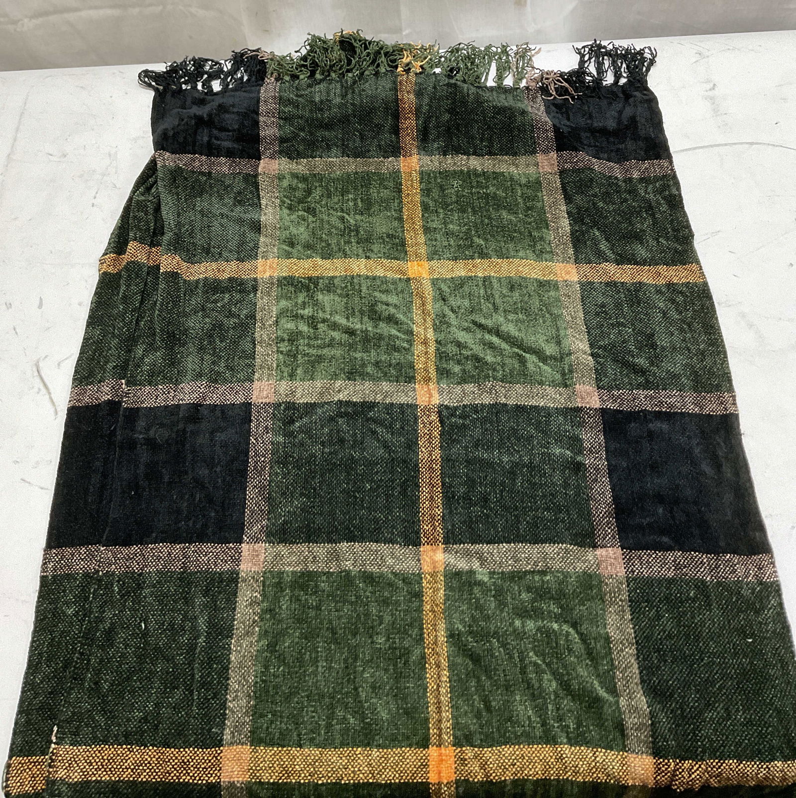 David & Young Flannel Fringed Scarf: David & Young flannel fringed scarf. Viscose material. Flannel pattern in black, green, yellow, and brown. Fringe trim in those colors. Measures approx 21 x 71 inches. Tag needs reattachment. Fringe i