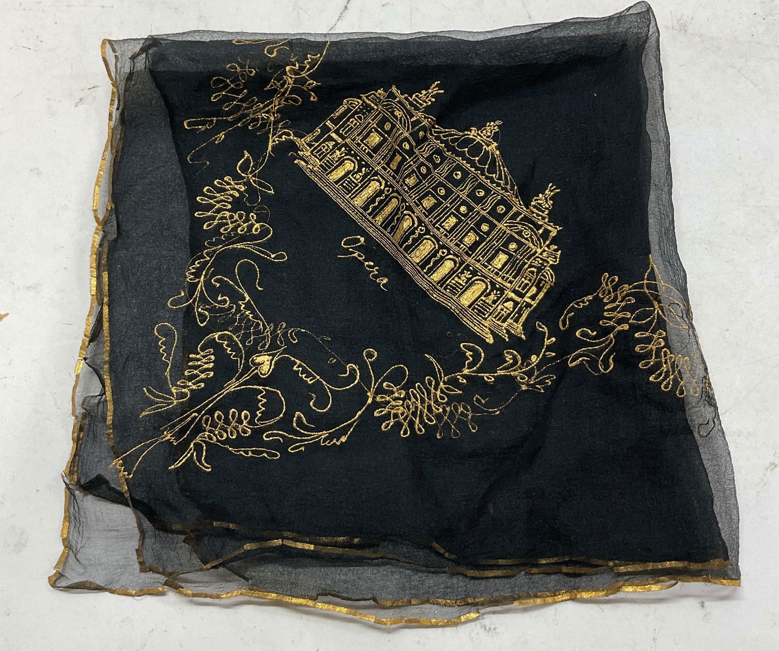 Vintage Embroidered Opera Black Sheer Handkerchief: Vintage embroidered opera black sheer silk handkerchief. Silk material. Gilt trim. Embroidered design of an opera house with the word opera underneath. Also reads Paris. Floral motifs. Measures approx