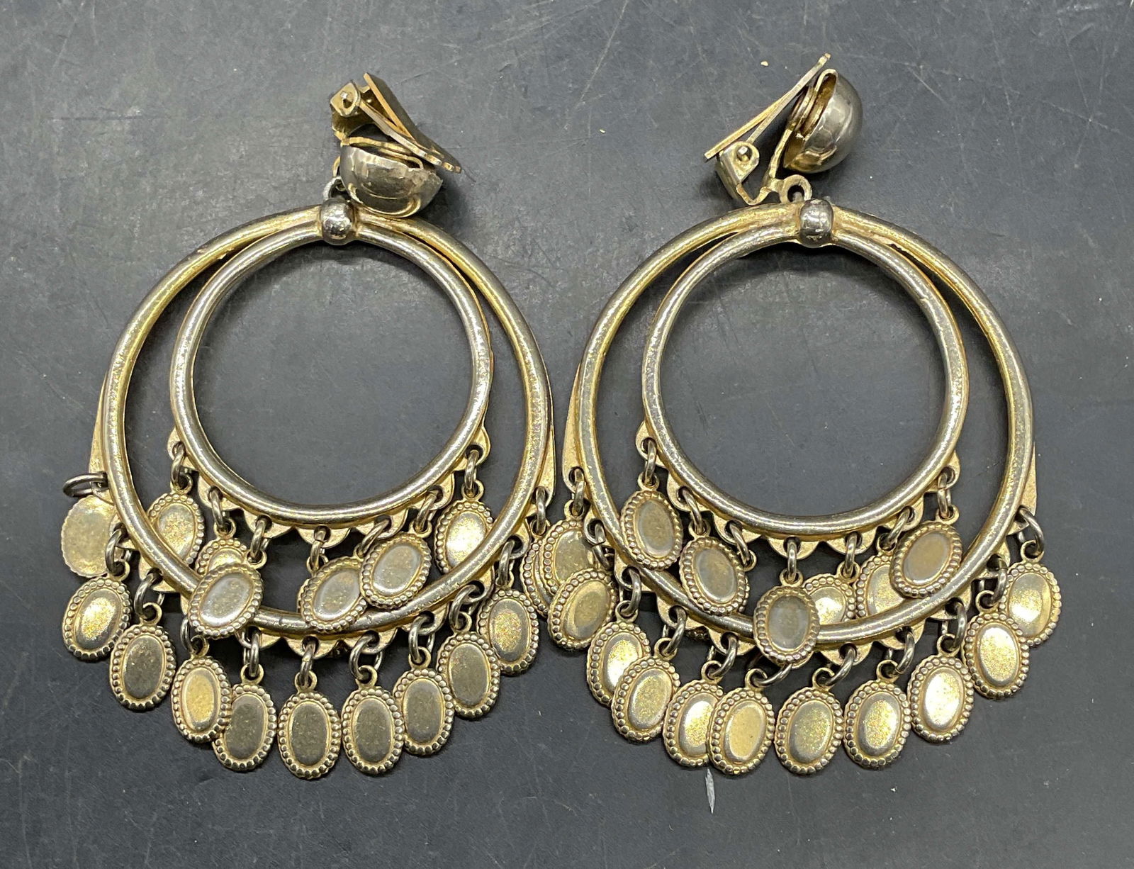 Vintage Gold Tone Double Circle Earrings: Vintage gold tone double circle dangle earrings. Measure approx 3 inches long. Some scratching. Jewelry, estate jewelry, costume jewelry, cocktail jewelry, fashion jewelry, accessories, fashion