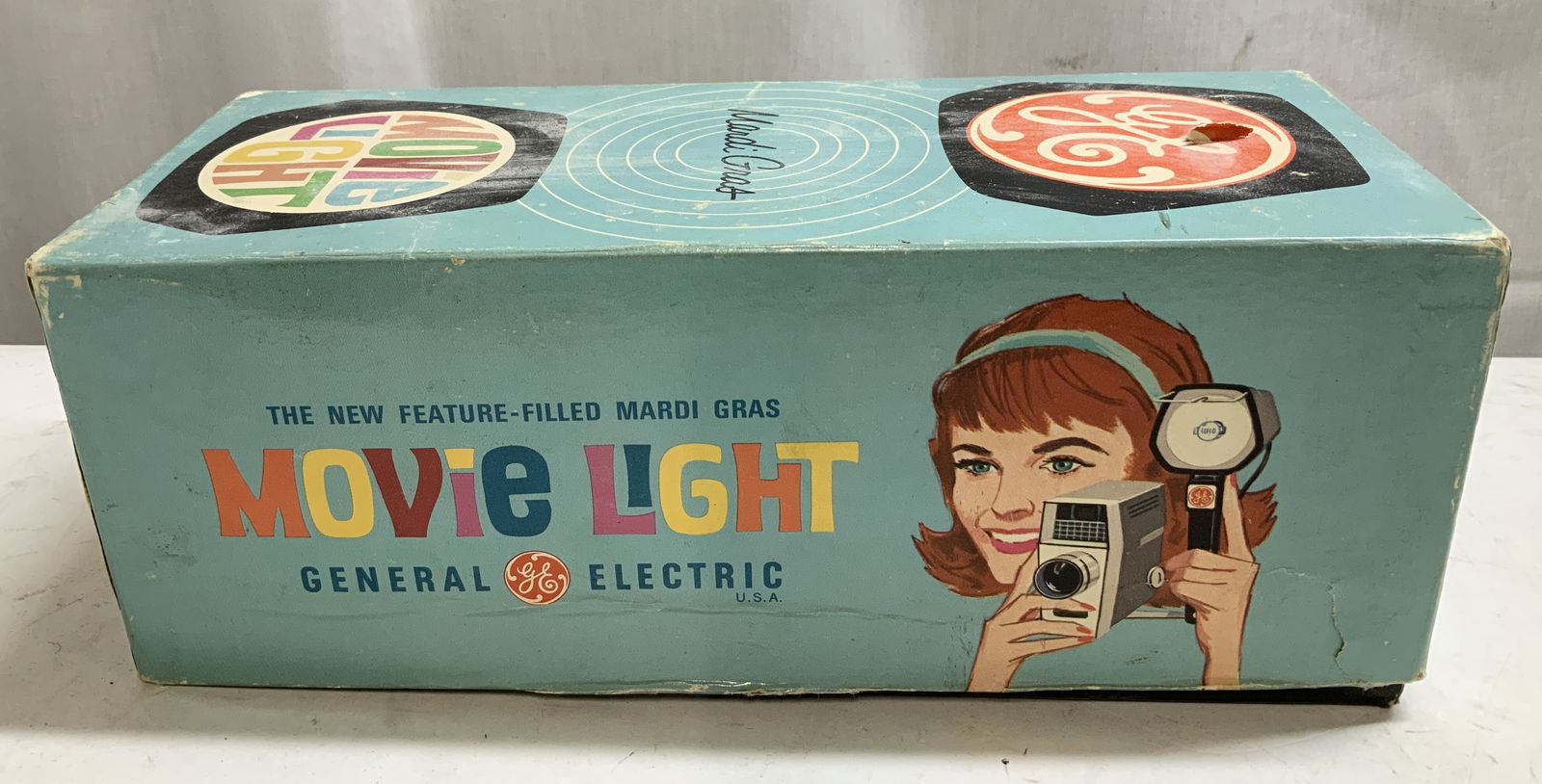 Vtg General Electric Mardi Gras Movie Light W Bx: Vintage General Electric Mardi Gras Movie Light, specifically the Model MG-1. Comes with original box. Property of Upper East Side French stage and screen actors estate, Manhattan. Surface wear consis
