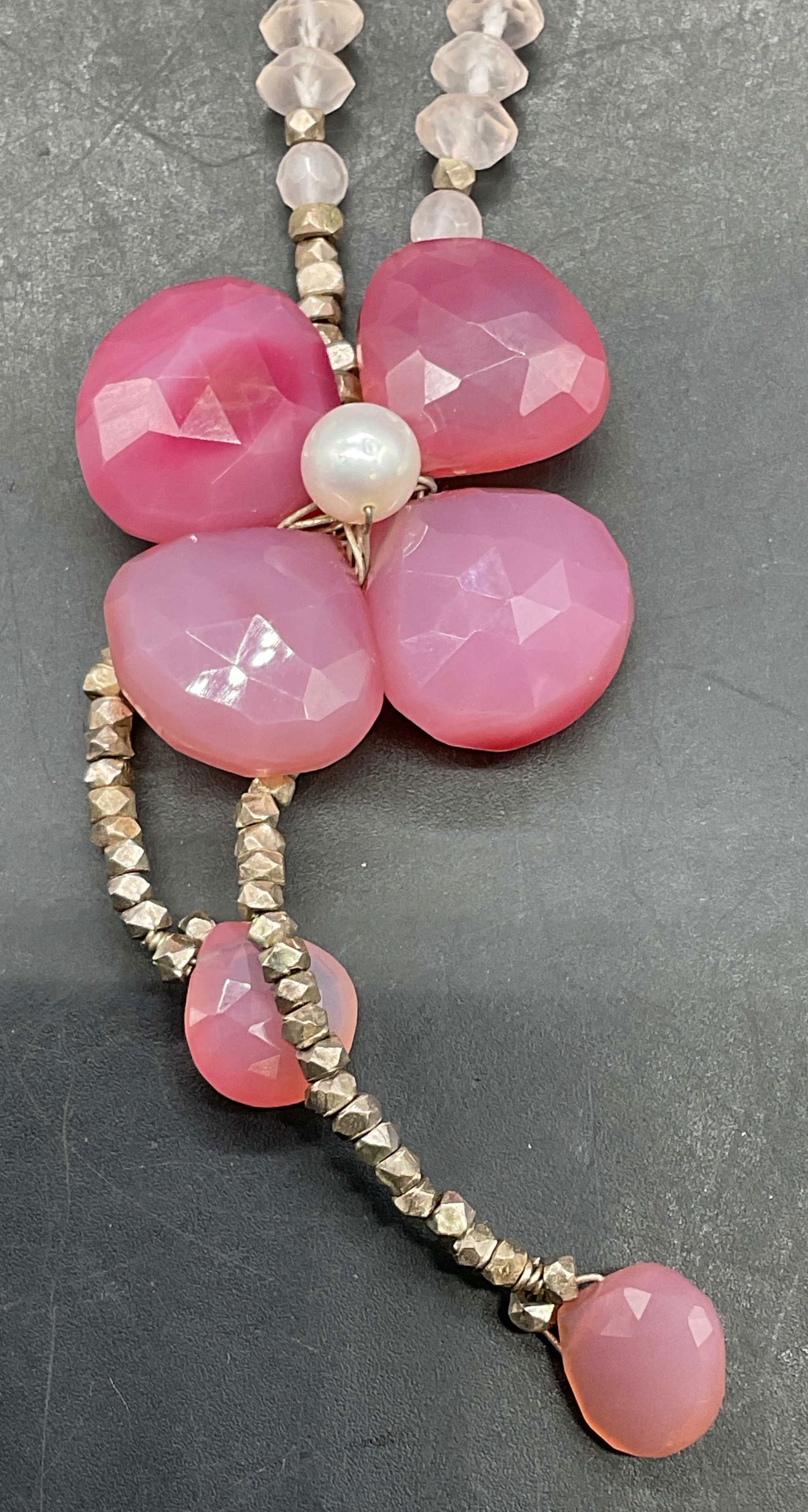 Signed Sterling Rose Quartz Pearl Necklace: Signed rose quartz and pearl flower pendant necklace with sterling silver accents. Marked sterling. Signed on hang tag. Drop length approx 6.75 inches. Some scratching. Jewelry, estate jewelry, fine j