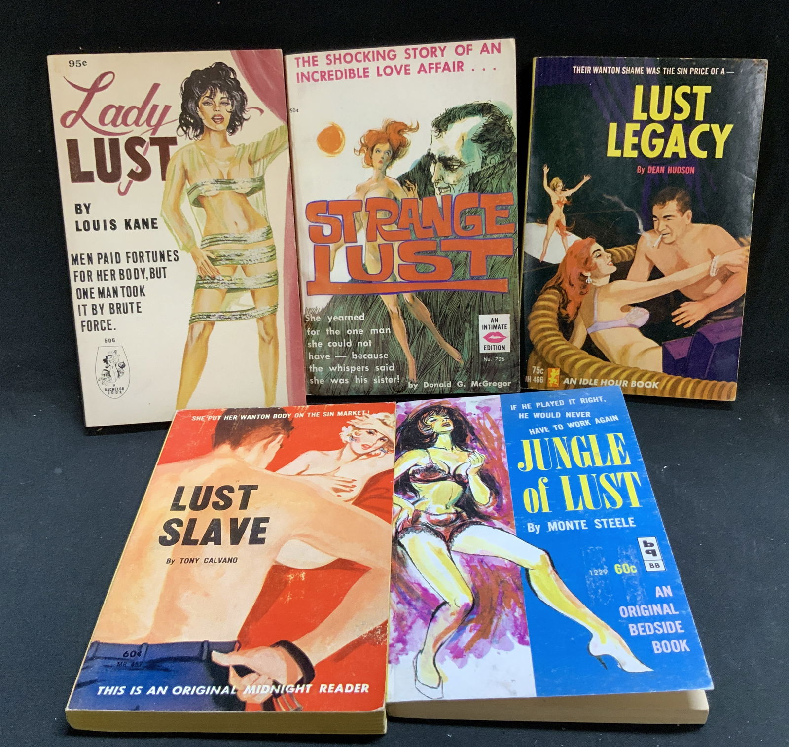 Lot 5 Pulp Fiction Erotica 1960s Books KANE: Lot includes, Lady Lust by Louis Kane (1966), Strange Lust by Donald McGregor (1963), Lust Legacy by Dean Hudson (1965), Lust Slave by Tony Calvano (1962) & Jungle of Lust by Monte Steele (1962). Fron