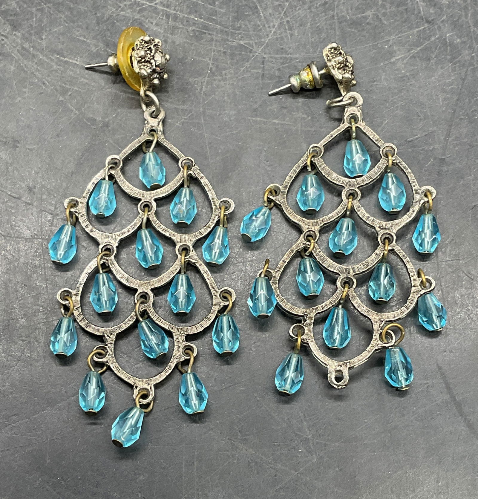 Vintage Silver Tone Blue Chandelier Earrings: Vintage silver tone blue lucite crystal chandelier earrings. Measures approx. 3 inches long. Some scratching. One crystal needs replacement. Jewelry, estate jewelry, costume jewelry, cocktail jewelry,