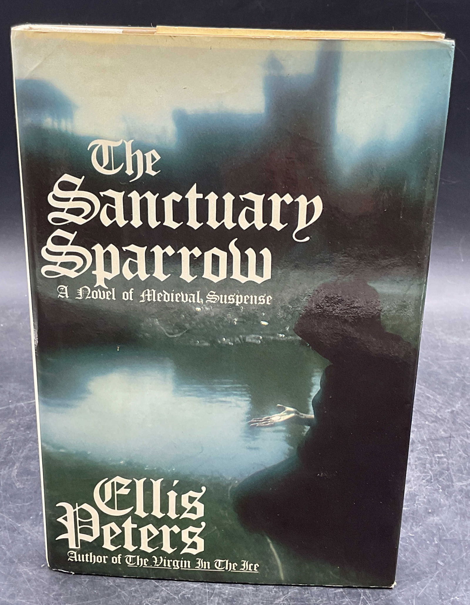 1983 Ellis Peters The Sanctuary Sparrow 1st Edt: Hardcover first American edition copy of The Sanctuary Sparrow by Ellis Peters. Morrow, 1983. Measures approx. 8.5 x 5.75 inches. wear to cover, pages, and binding consistent with exposure. Book, coll
