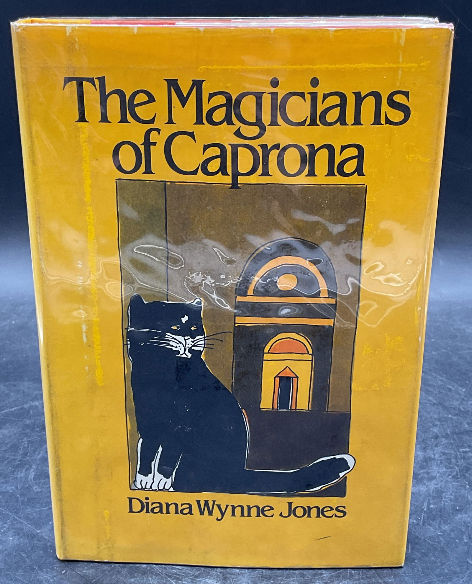 1980 Wynne Jones Magicians Caprona 1st Edition: Hardcover first American edition copy of The Magicians of Caprona by Diana Wynne Jones. Greenwillow, 1980. Measures approx. 8.5 x 5.75 inches. wear to cover, pages, and binding consistent with